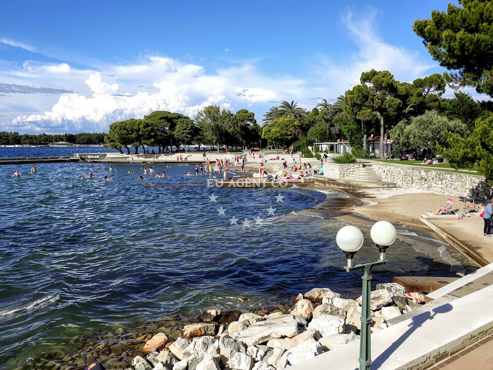 Shoreline and swimming area at Umag Sandy beach in ISTARSKA 47, Umag