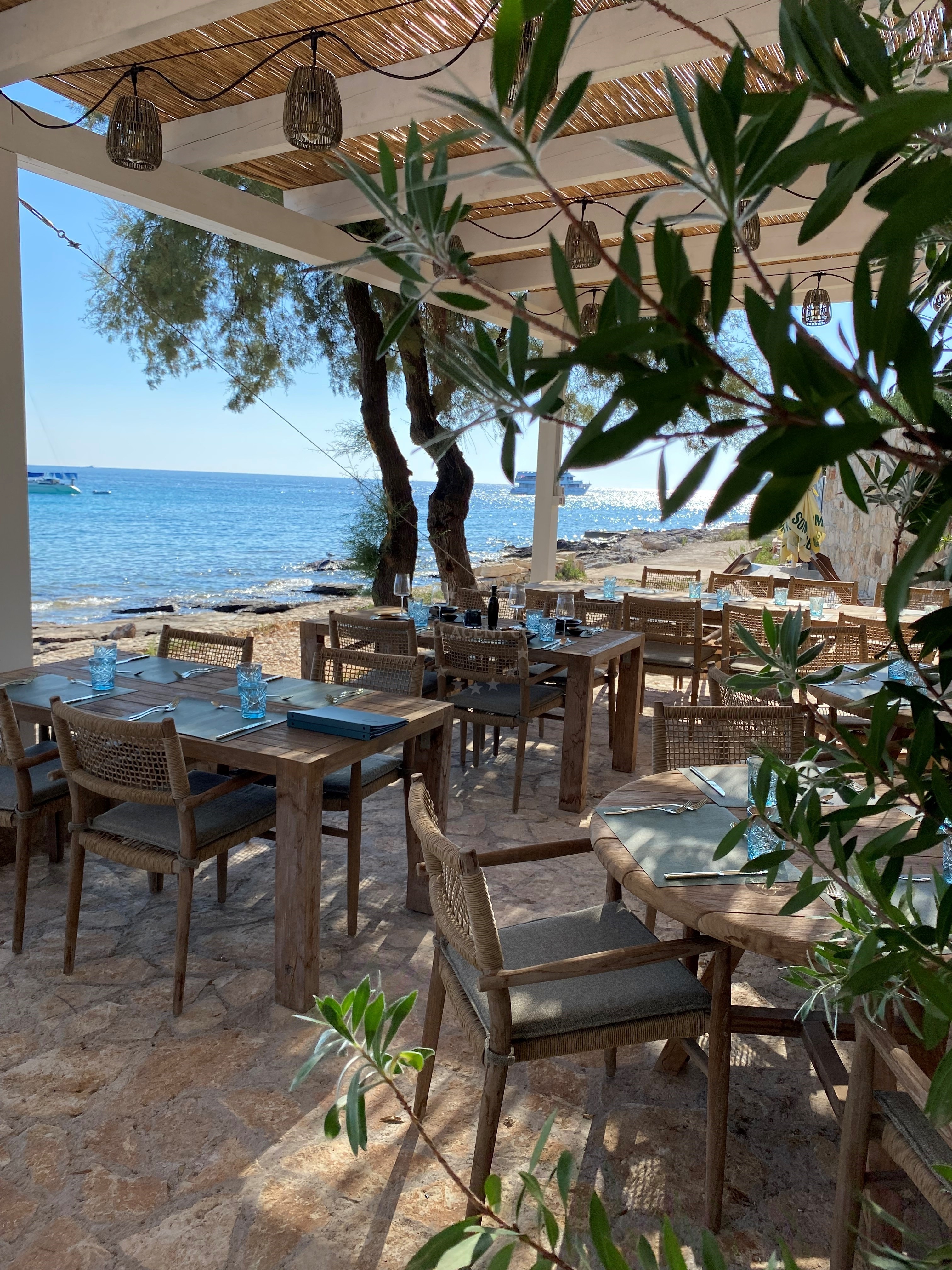 Yacht moored at Restaurant Carubo buoys with views of Drvenik Mali Island
