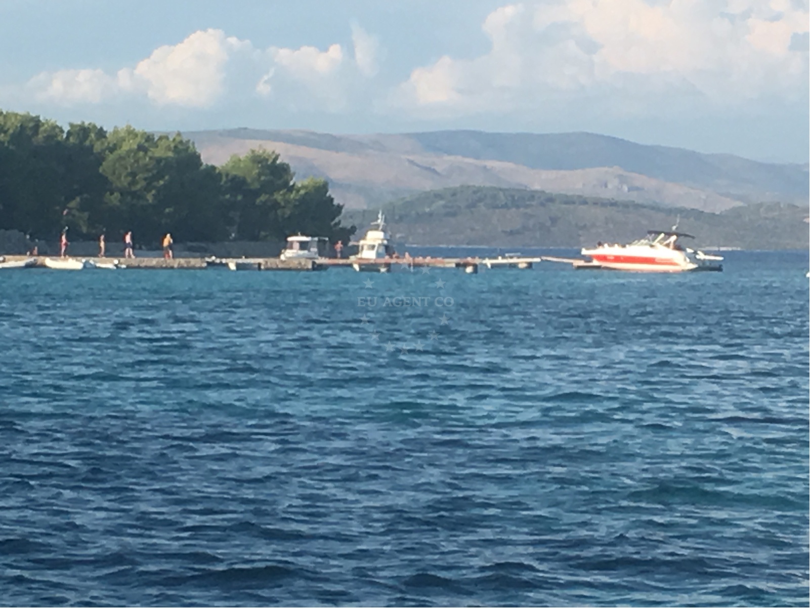 Boats docking at the jetty on Drvenik Veli Island