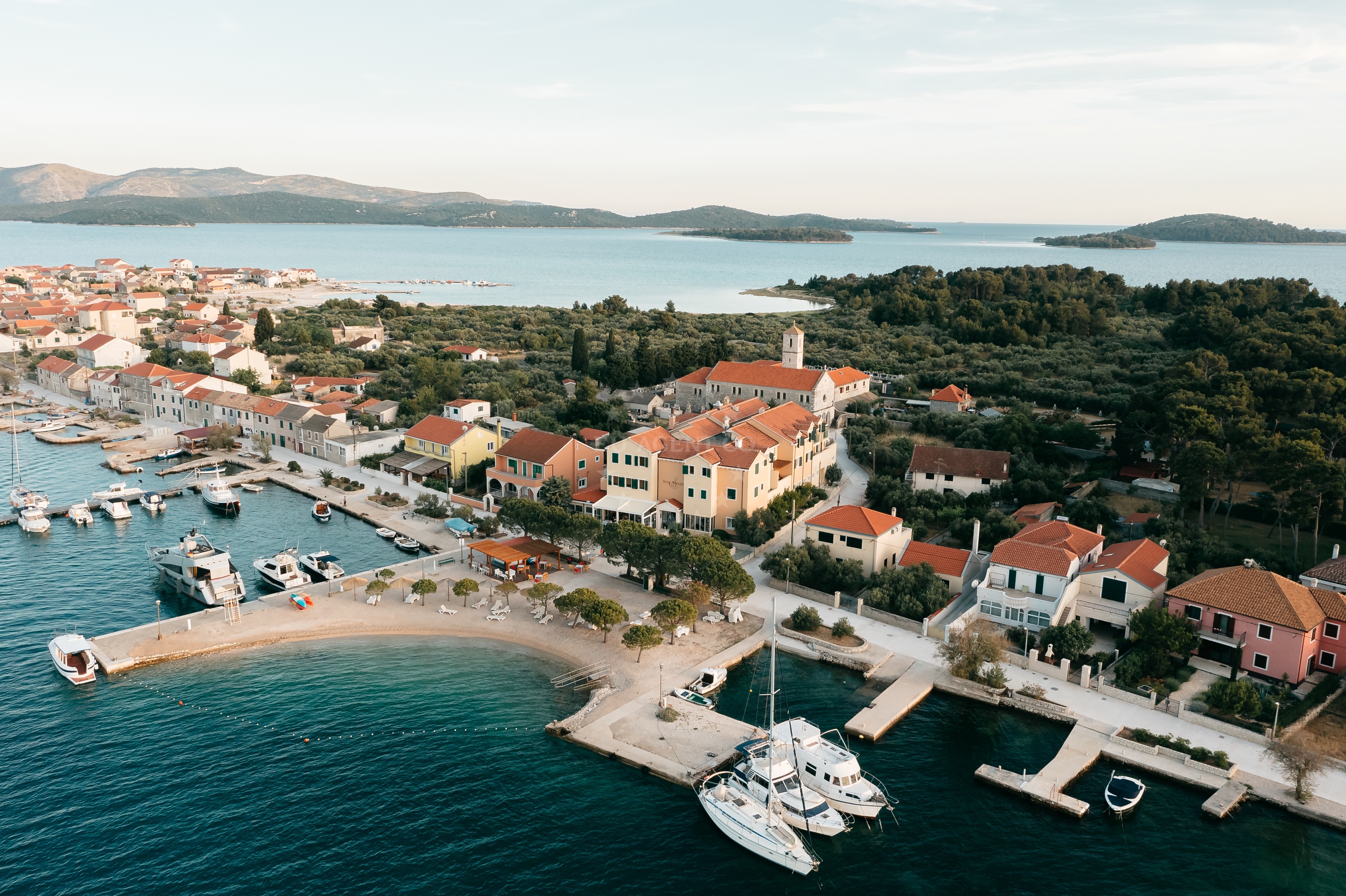 Hotel Spongiola Jetty in Krapanj, Croatia with mooring lines and yachts