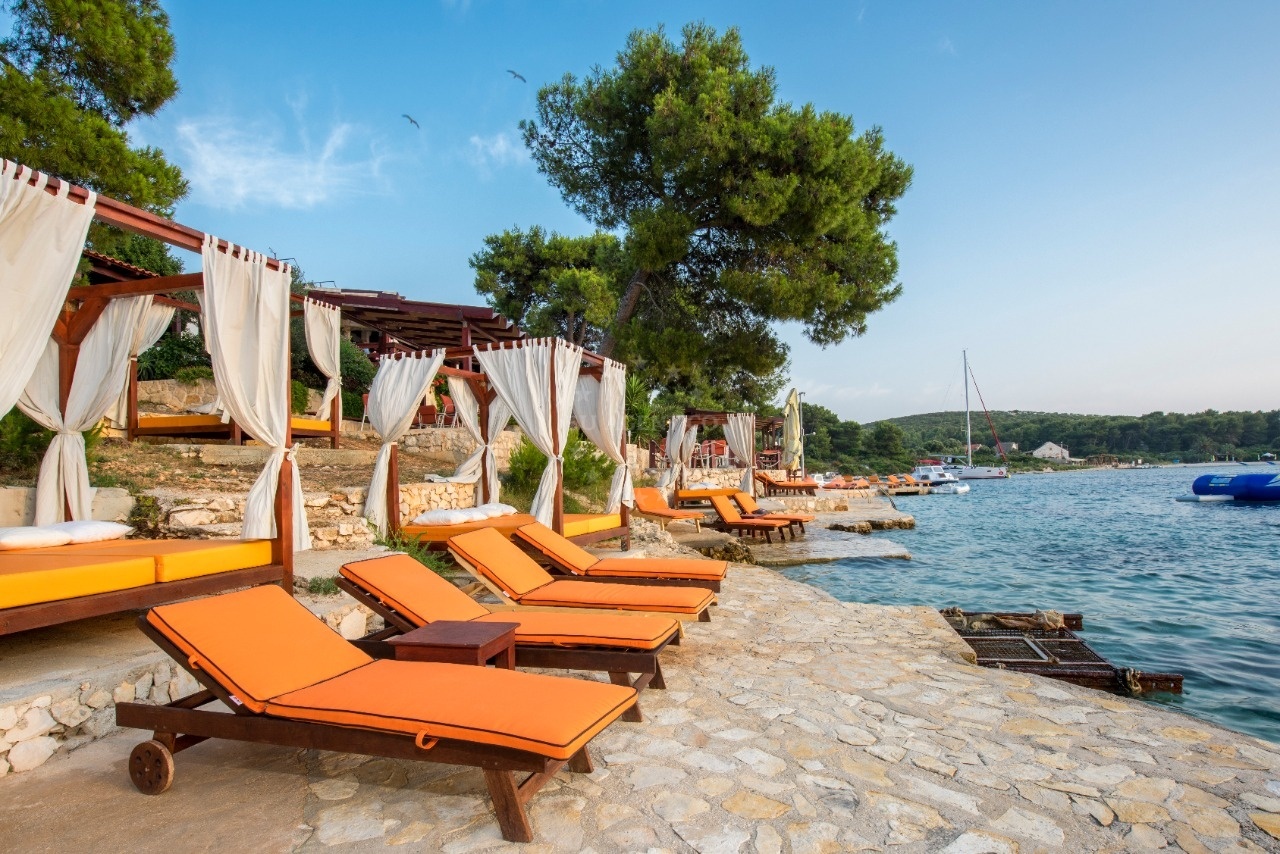 Restaurant jetty with moored yacht and Adriatic sea view
