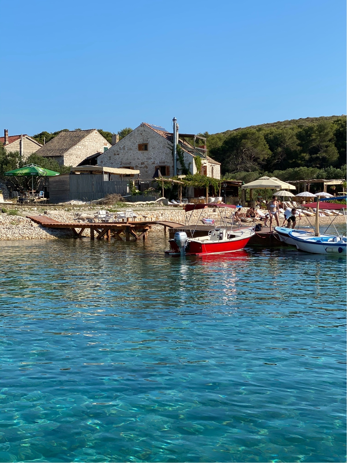 Watertaxi docked at quay near Ždrilca Bay, Croatia
