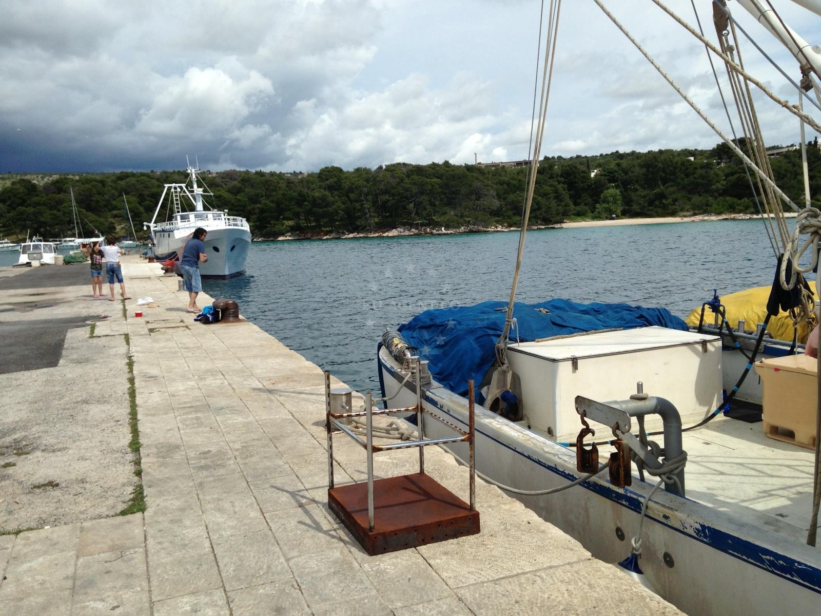 Primosten quay with local fishing boats and ferry