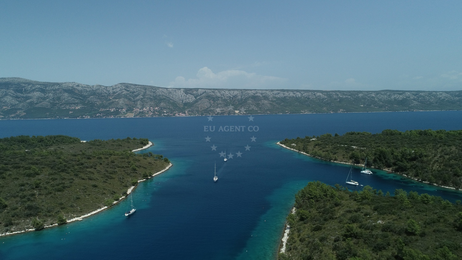 Sailboats moored at buoy field in Lovišće Bay