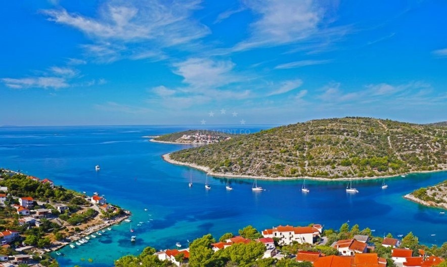 Sicenica Bay with mooring buoys and Muljica Island, Croatia