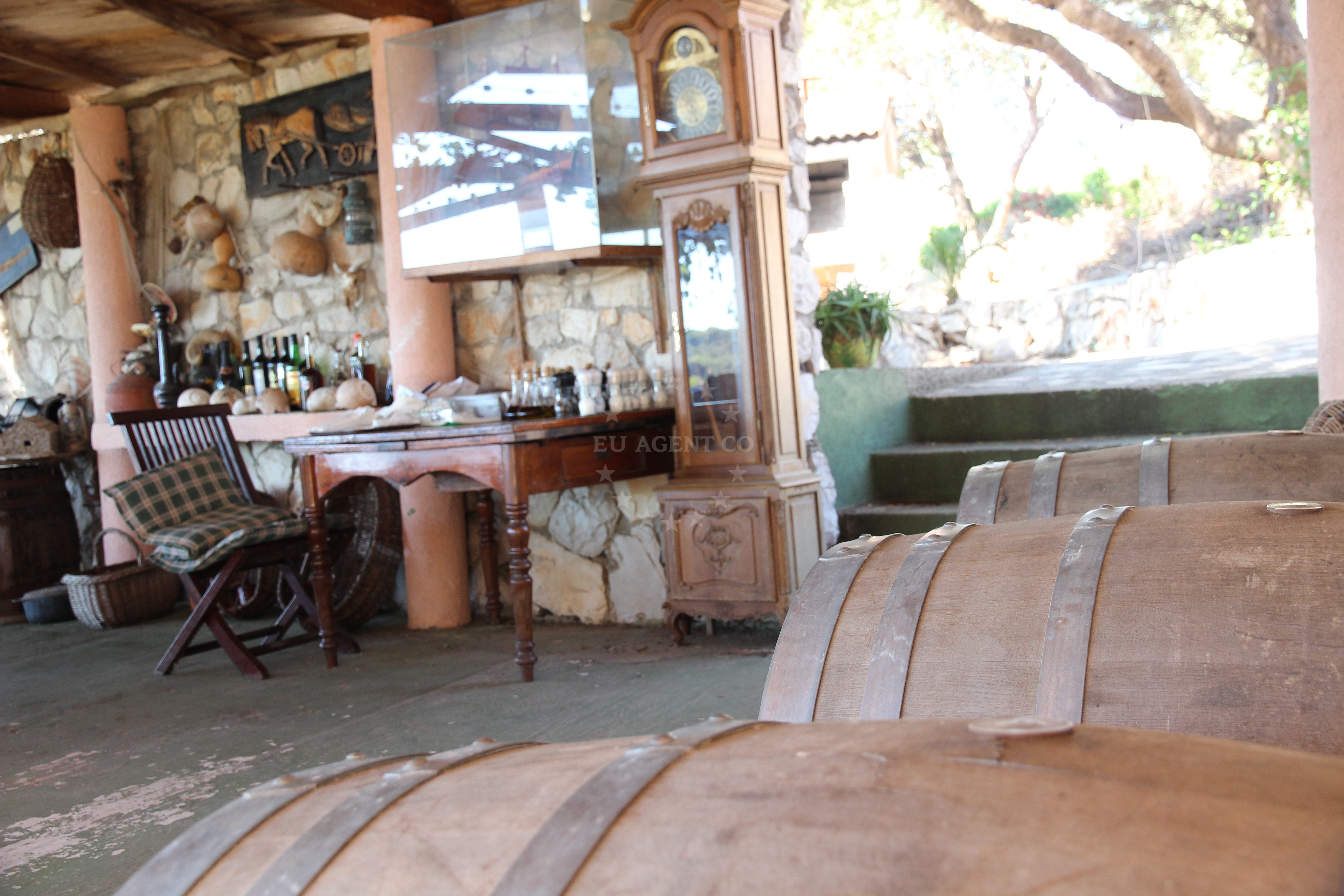 Rustic dining area at Konoba Paradiso with sea view