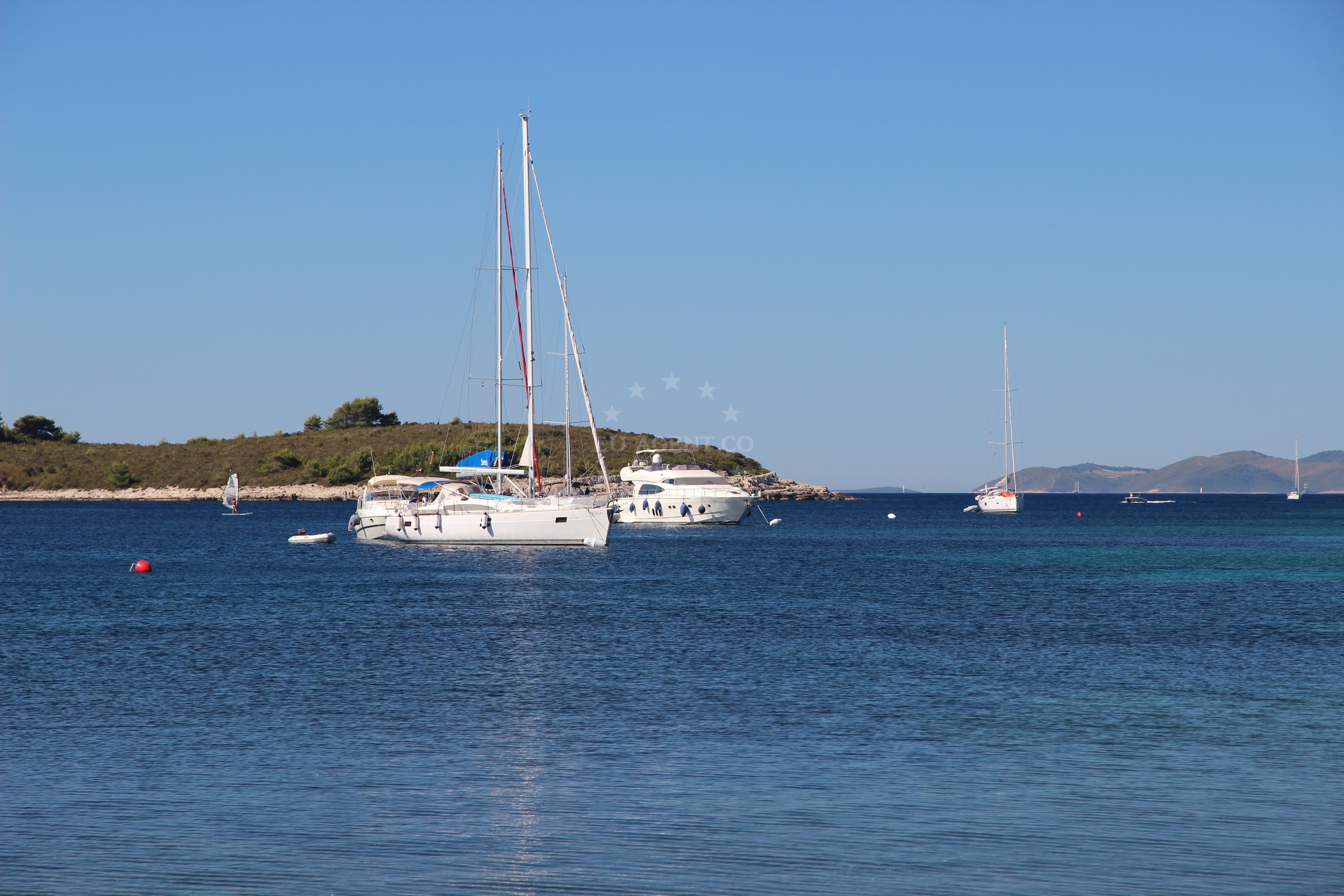 Soline Bay with yachts anchored near pine forest