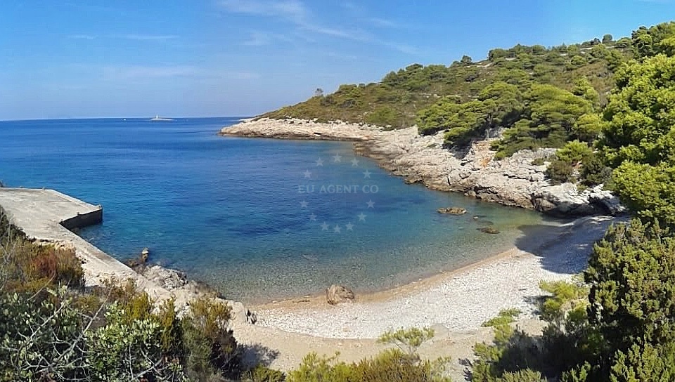 Small quay on Vis Island, Croatia with motoryacht moored near Barjaska Bay