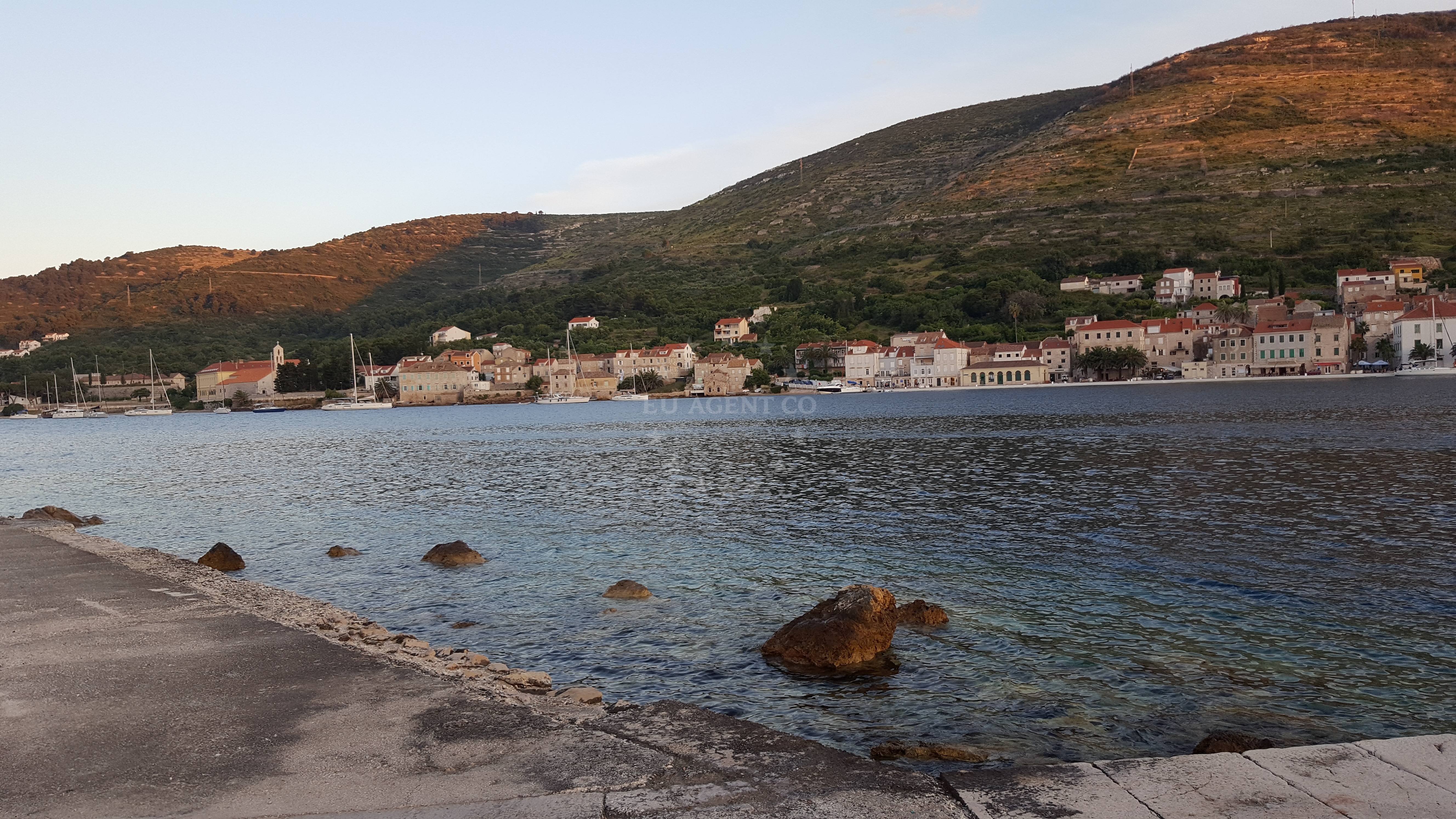 Sailboat mooring at buoy field in Vis