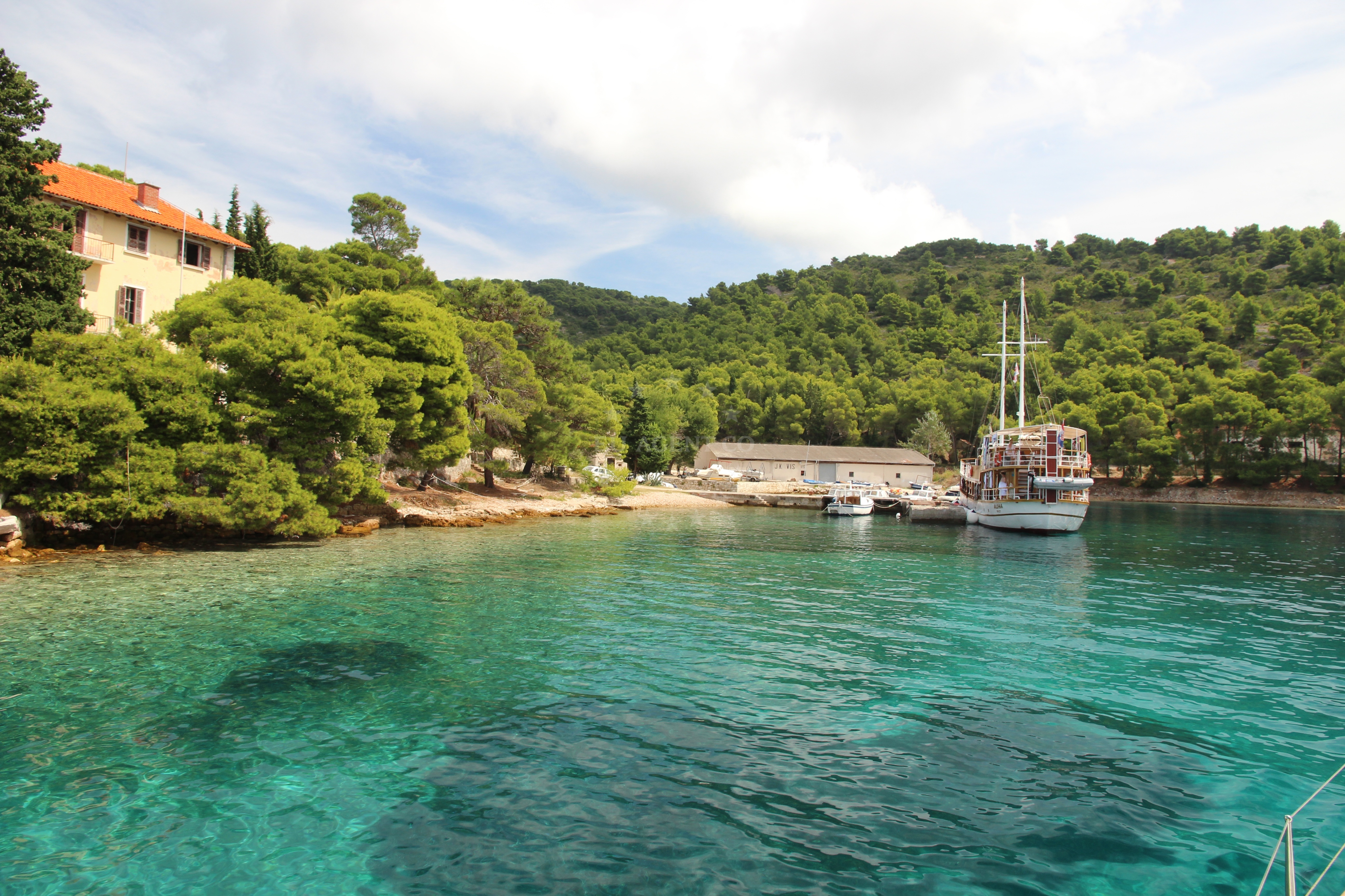 View of the jetty and surrounding coastal landscape in Vis