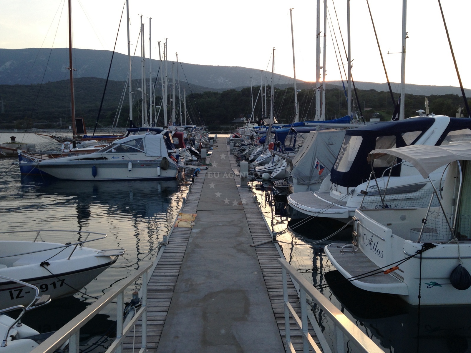 Jetty in Osor, Cres with mooring facilities and view of Restaurant Adria