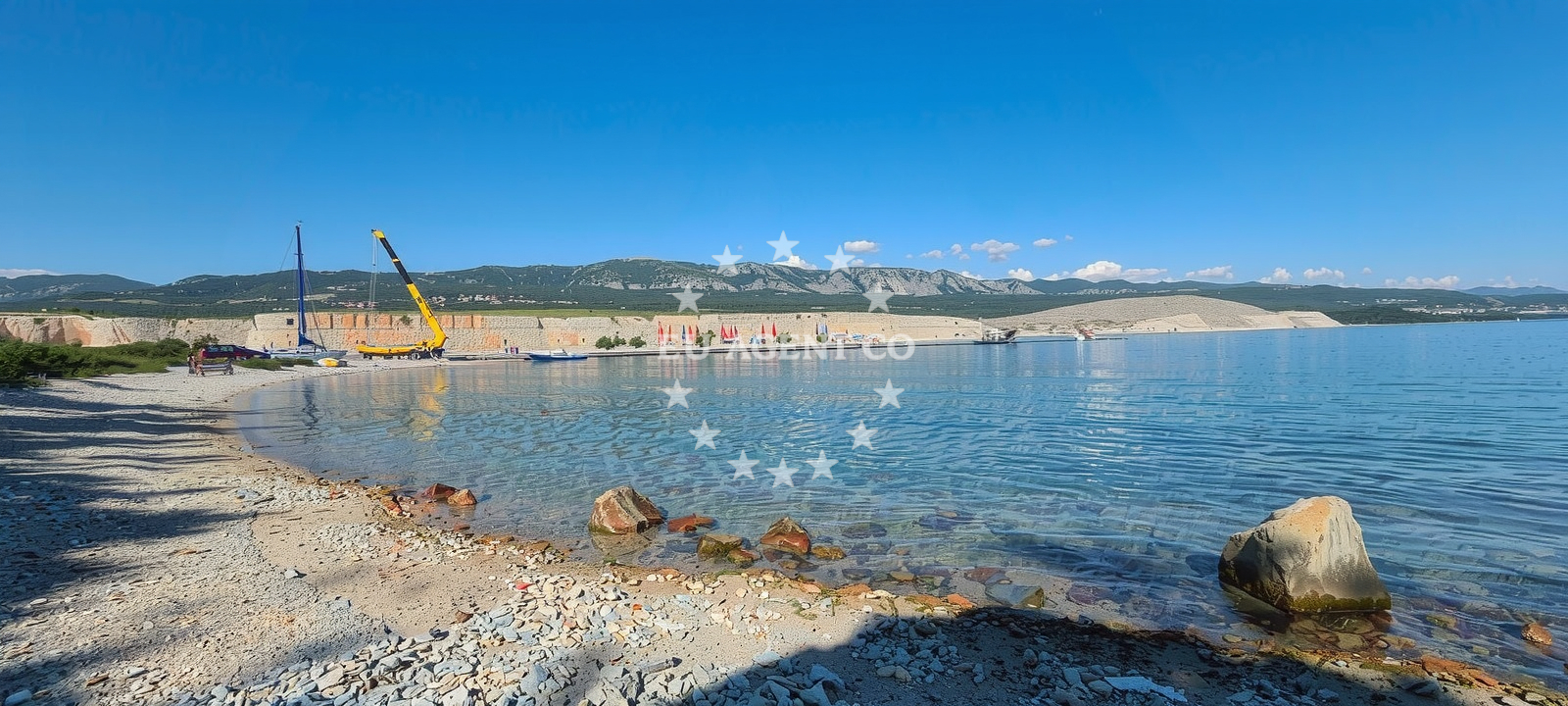 Voz Bay on the island of Krk, Croatia with clear waters and rocky shores