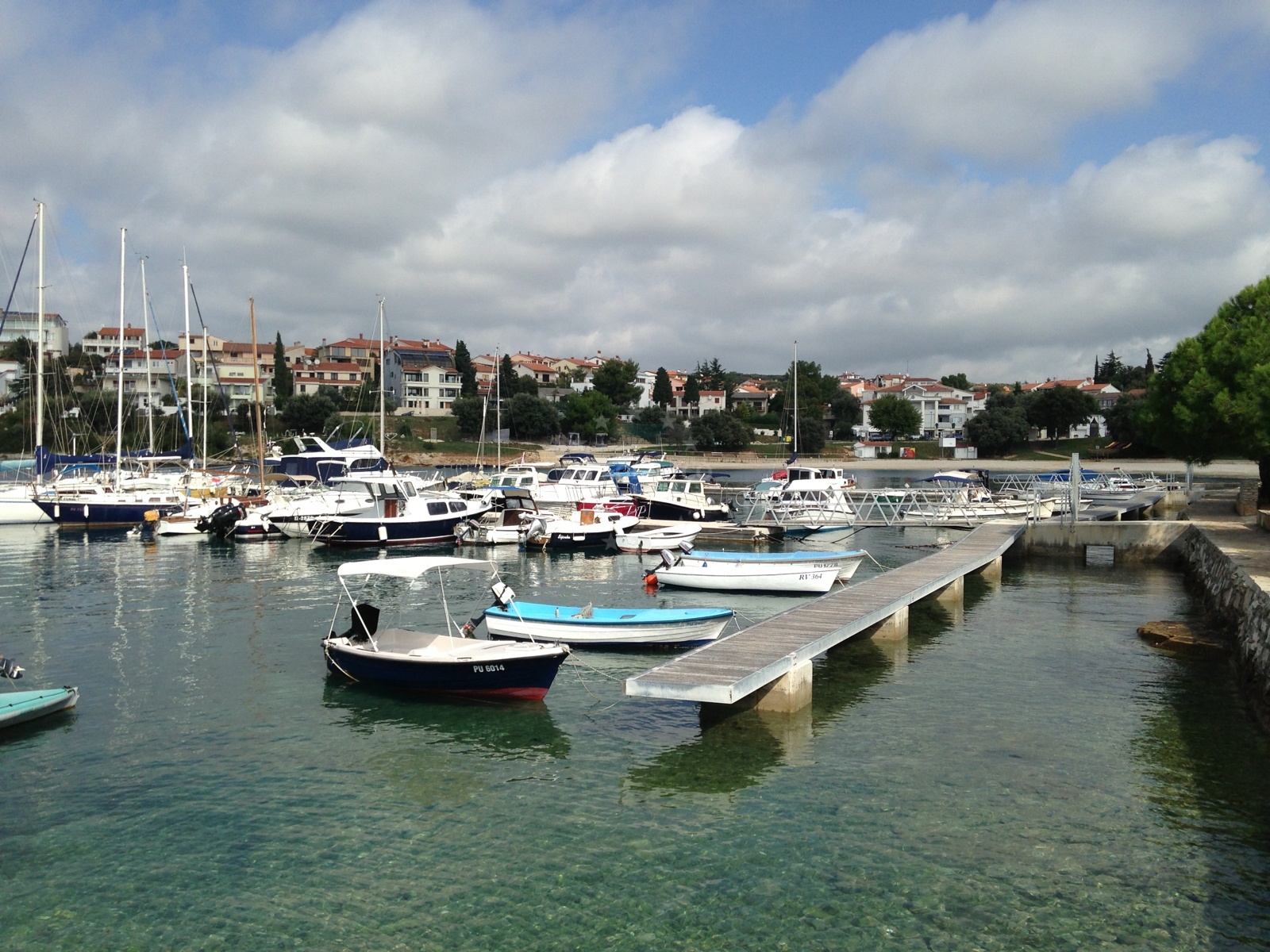 Jetty in Pula, Croatia, with local boats moored nearby