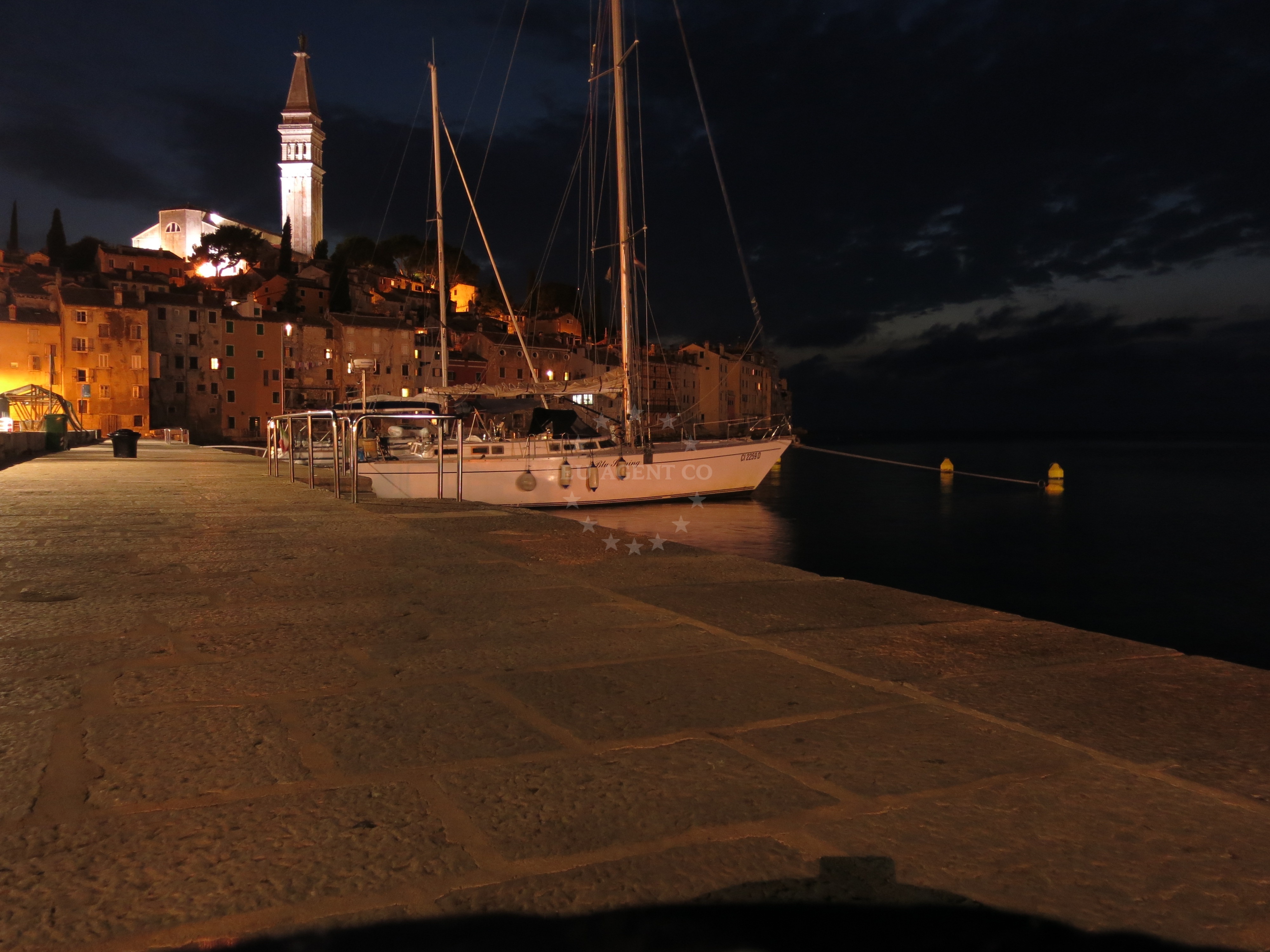 Anchored vessel at Rovinj quay with Adriatic Sea backdrop