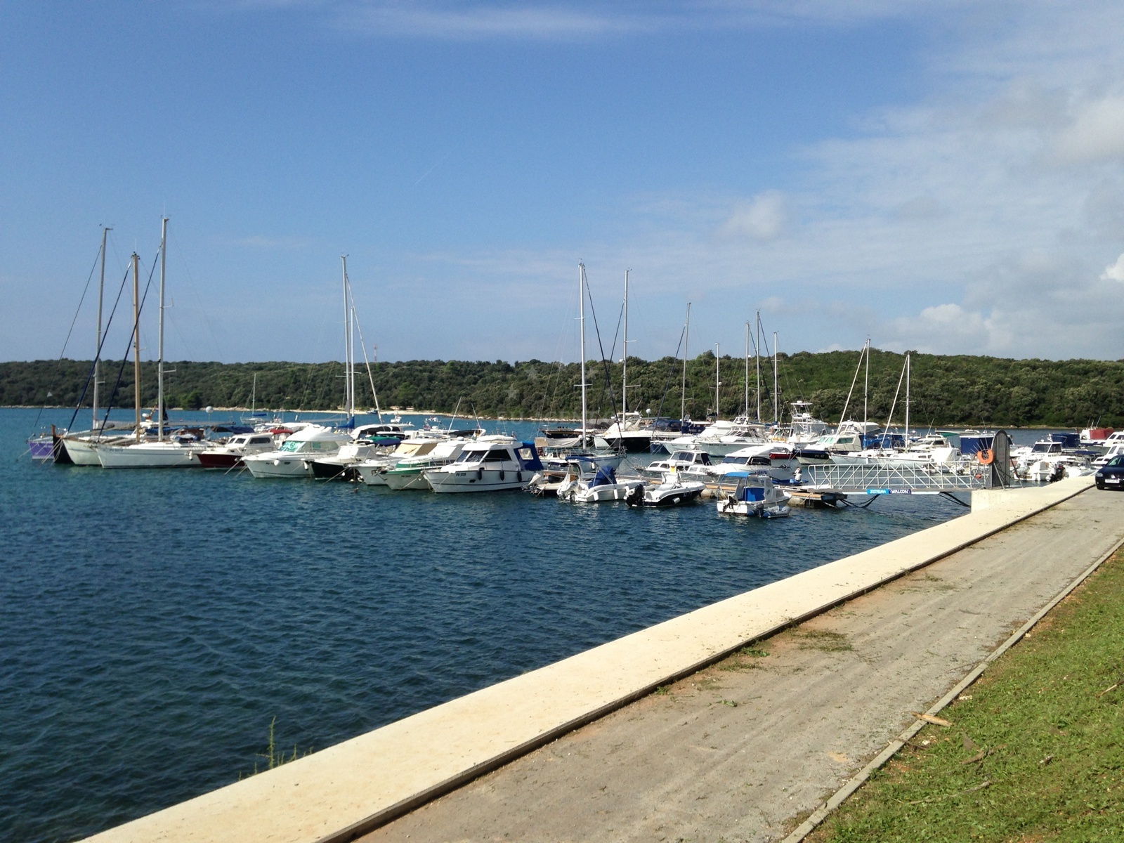 Jetty in Vinkuran, Croatia with boats moored nearby