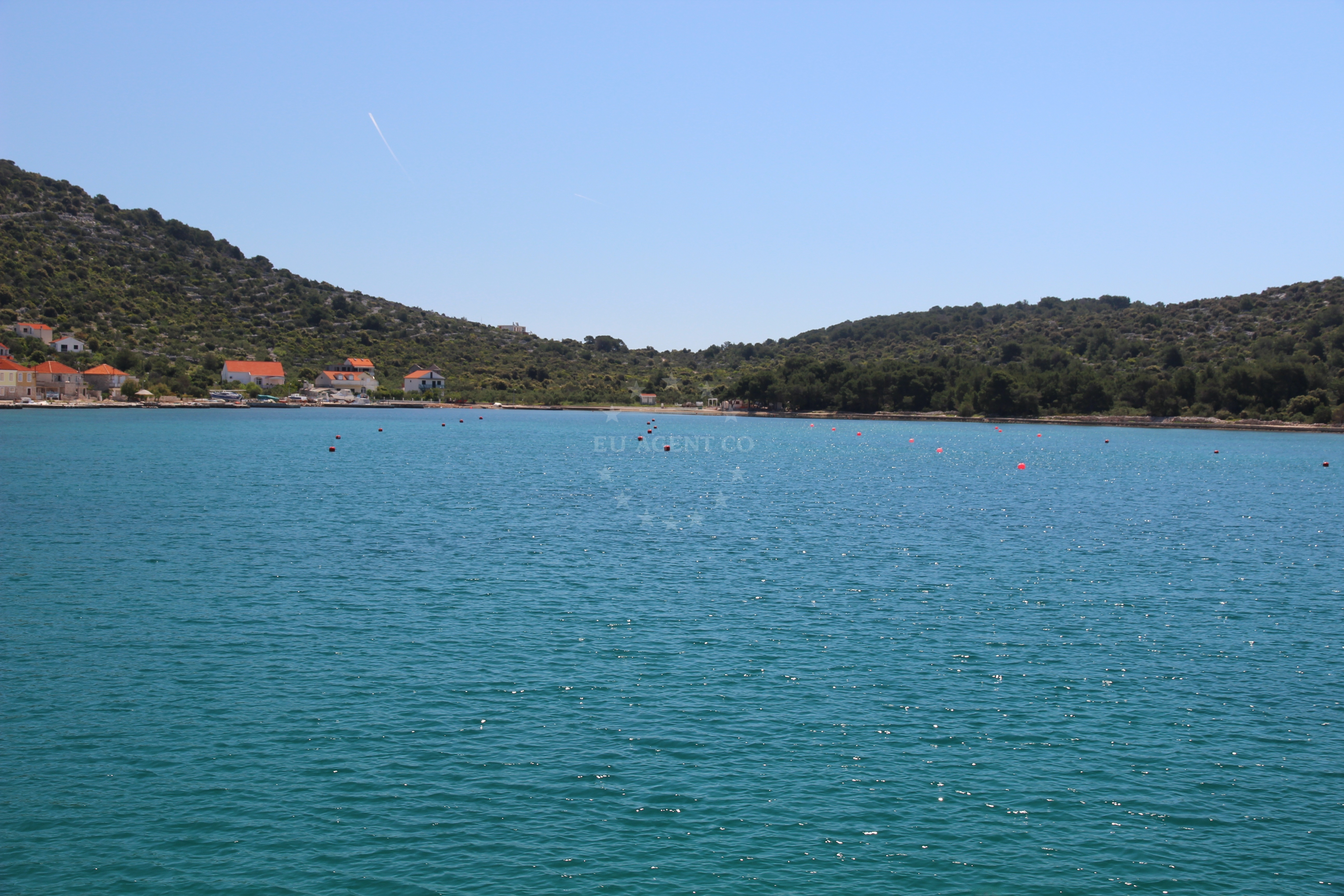 Nautical view of Kaprije buoy field with Adriatic Sea in the background