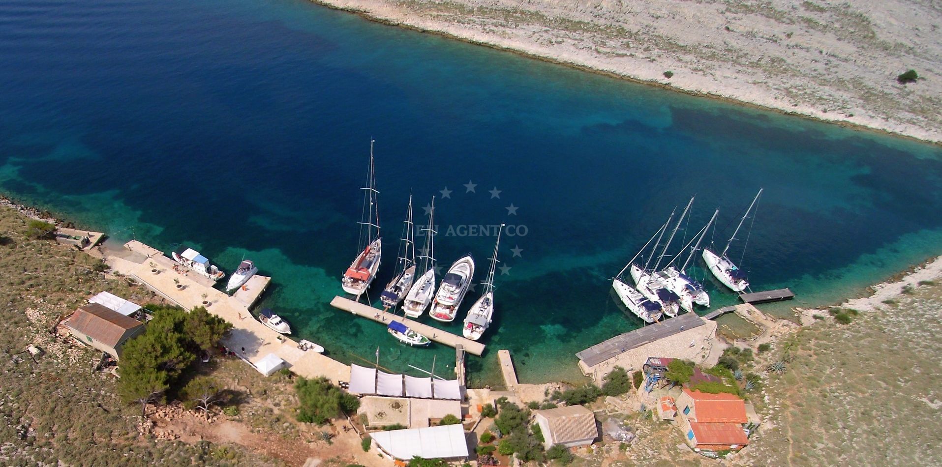 Konoba Opat Jetty with mooring lines and Adriatic Sea view