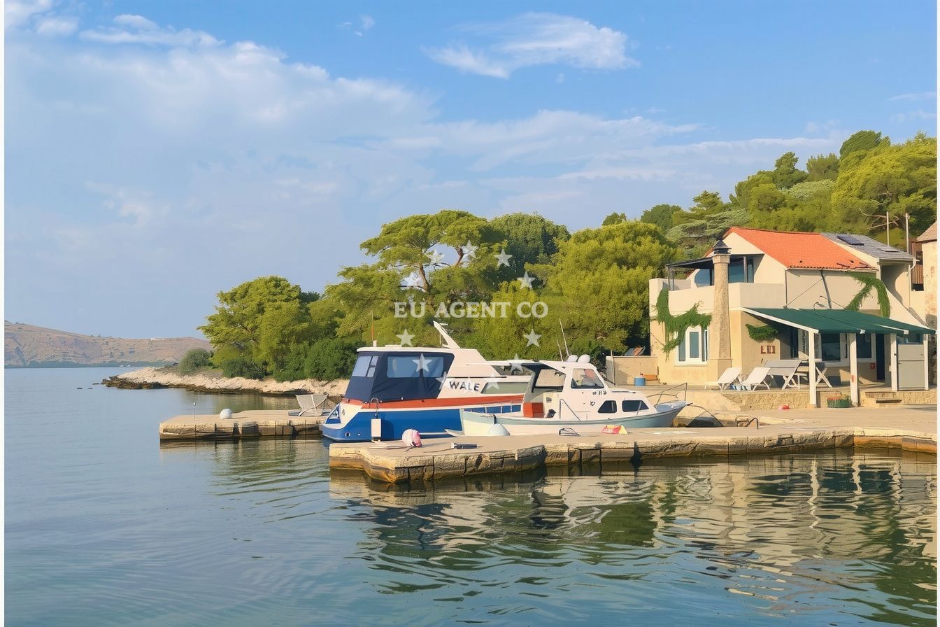 Jetty on Lavsa Island, North Dalmatia, Croatia with boats moored nearby