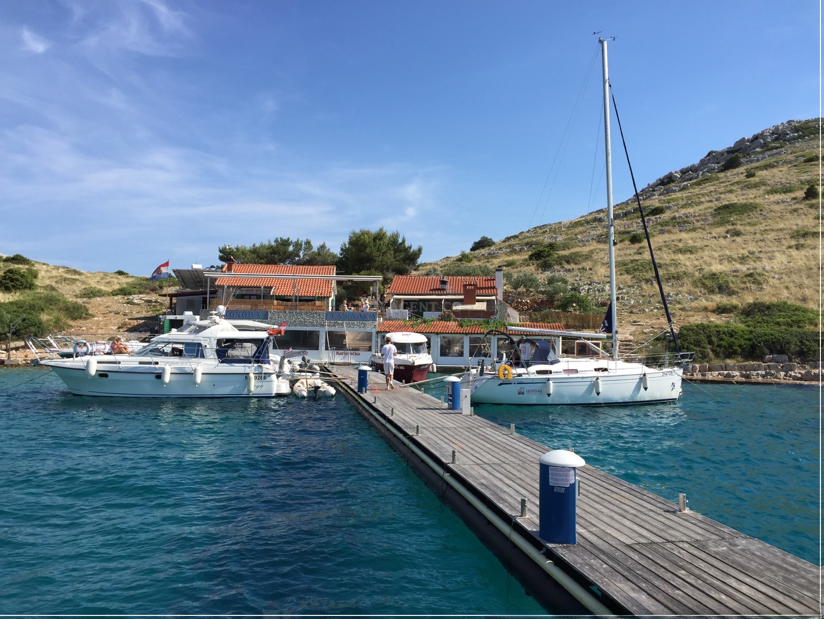 Konoba Levranaka Jetty with moored boats near Levrnaka Island, North Dalmatia