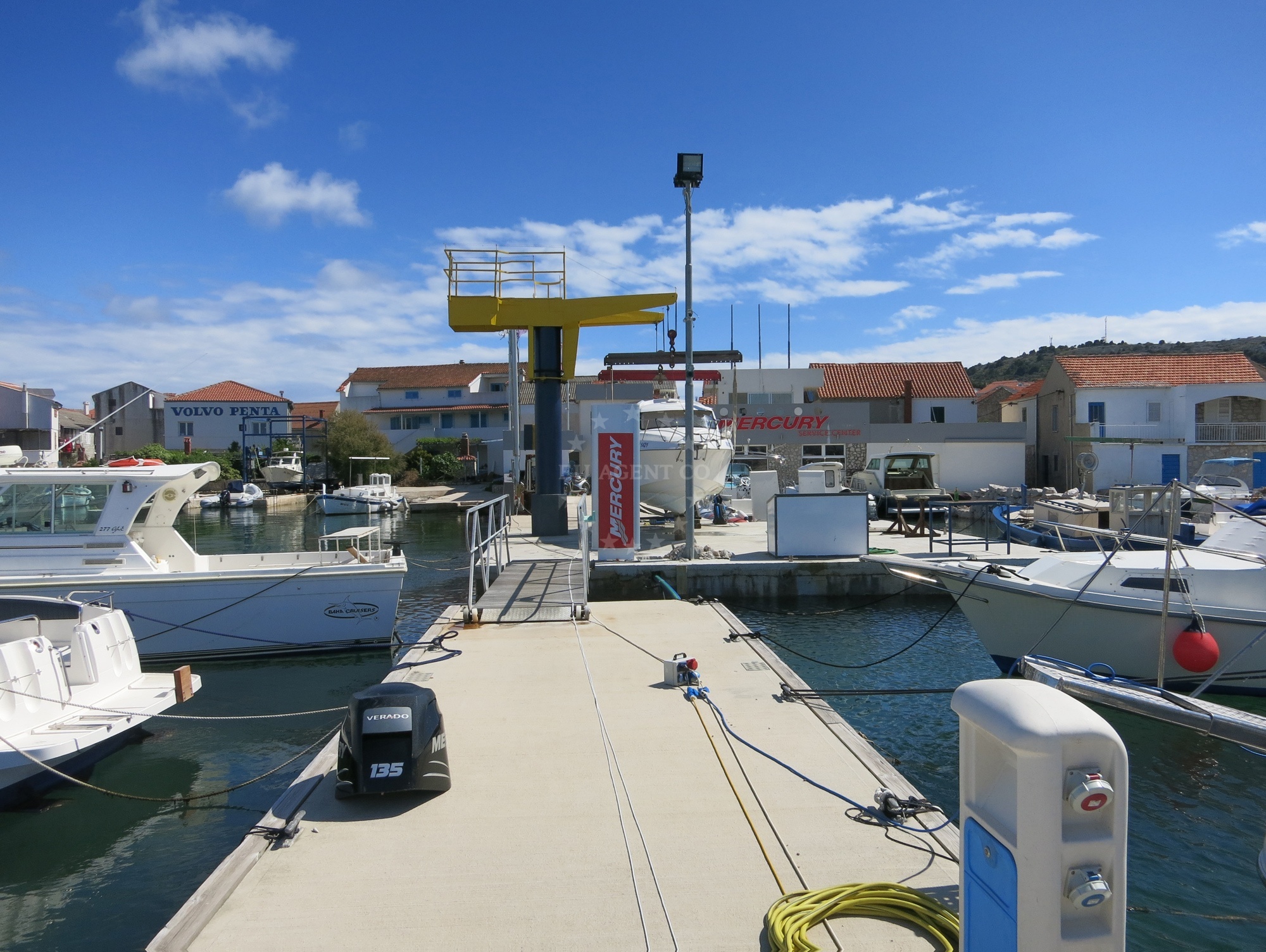 Boat moored at Murter Nautika buoy with nearby harbor in North Dalmatia
