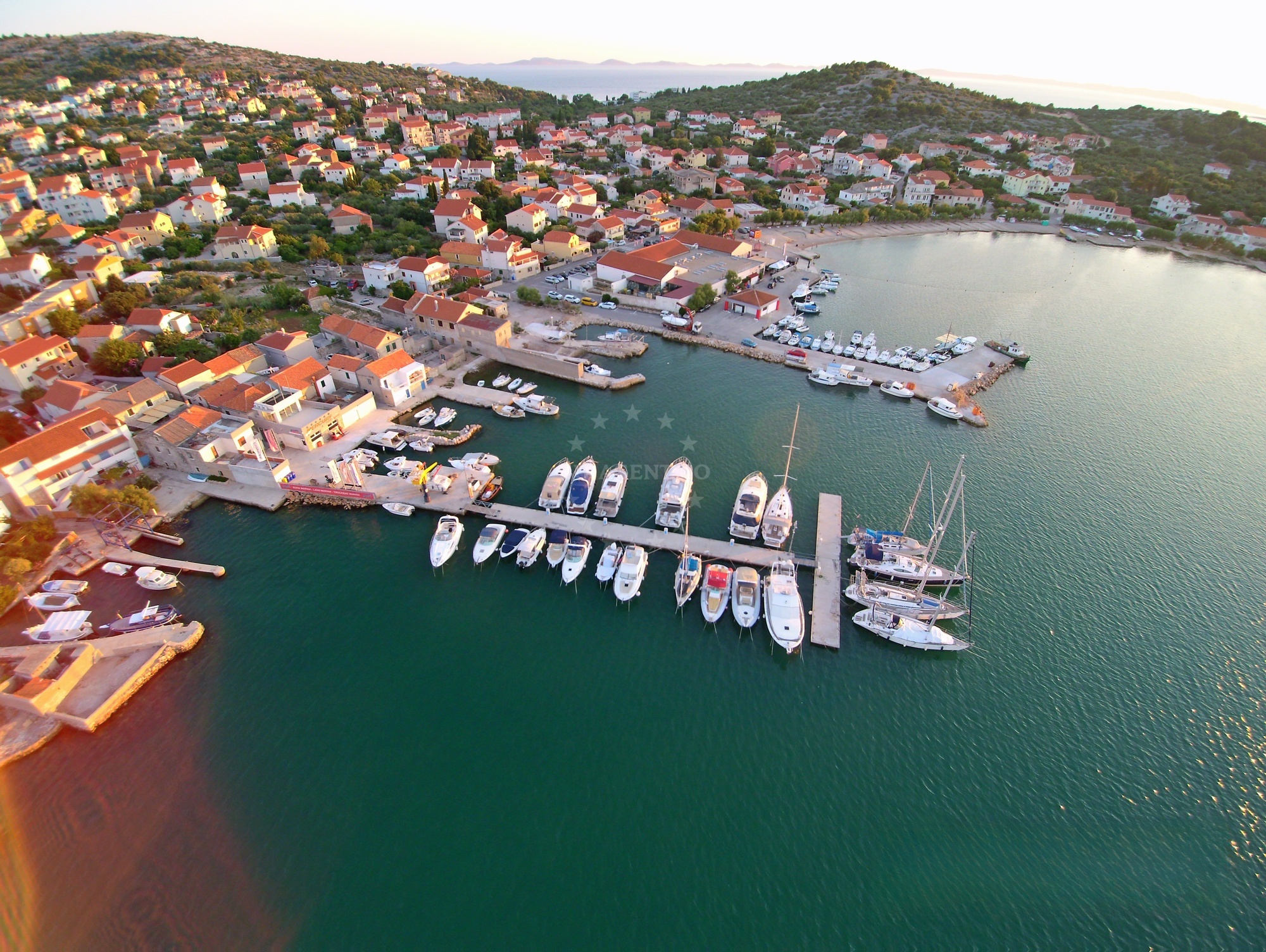 Adriatic coastline near Murter Nautika buoy with marina in distance