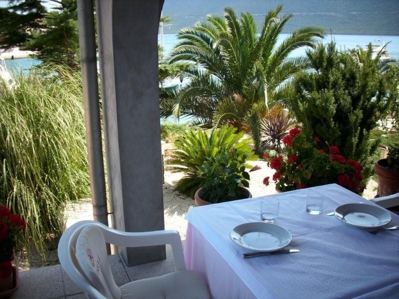 View of Rava coastline with buoy field and restaurant in the distance