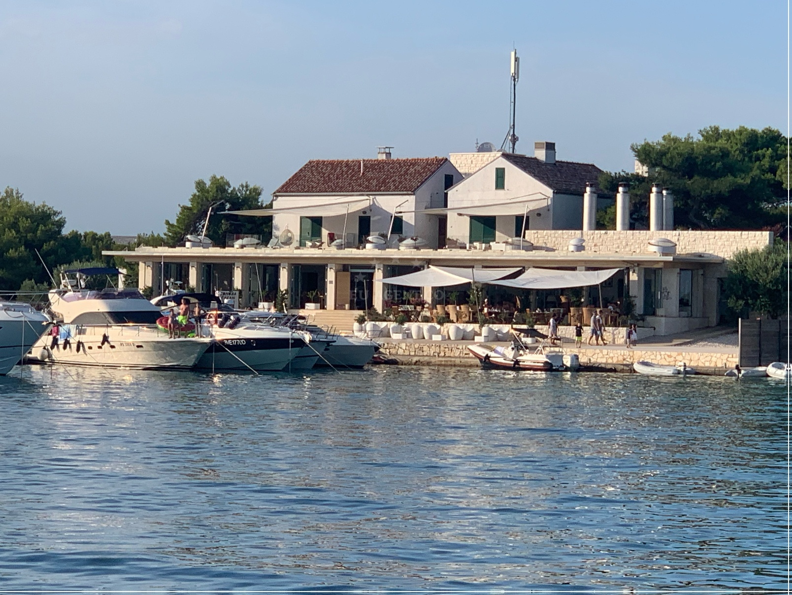 Boat approaching Restaurant Zakan Jetty, North Dalmatia