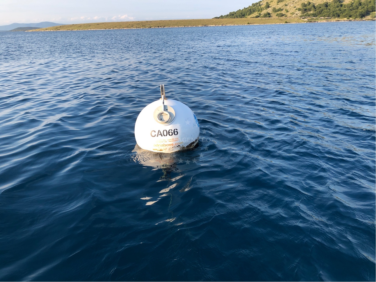 Buoy field on Zut Island, North Dalmatia, Croatia, with Adriatic Sea in the background
