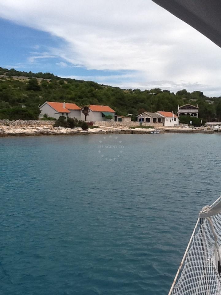 Buoy field in Dragisina, Zut, North Dalmatia, Croatia with Konoba Vison in the distance