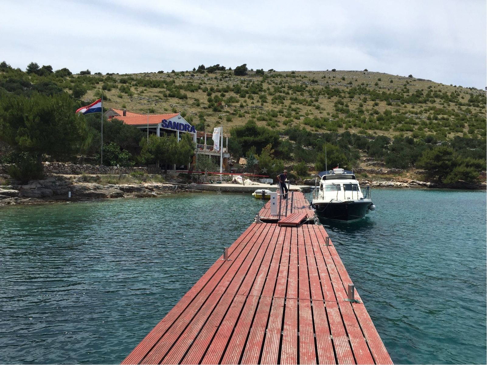 Jetty structure with depth markers and mooring lines