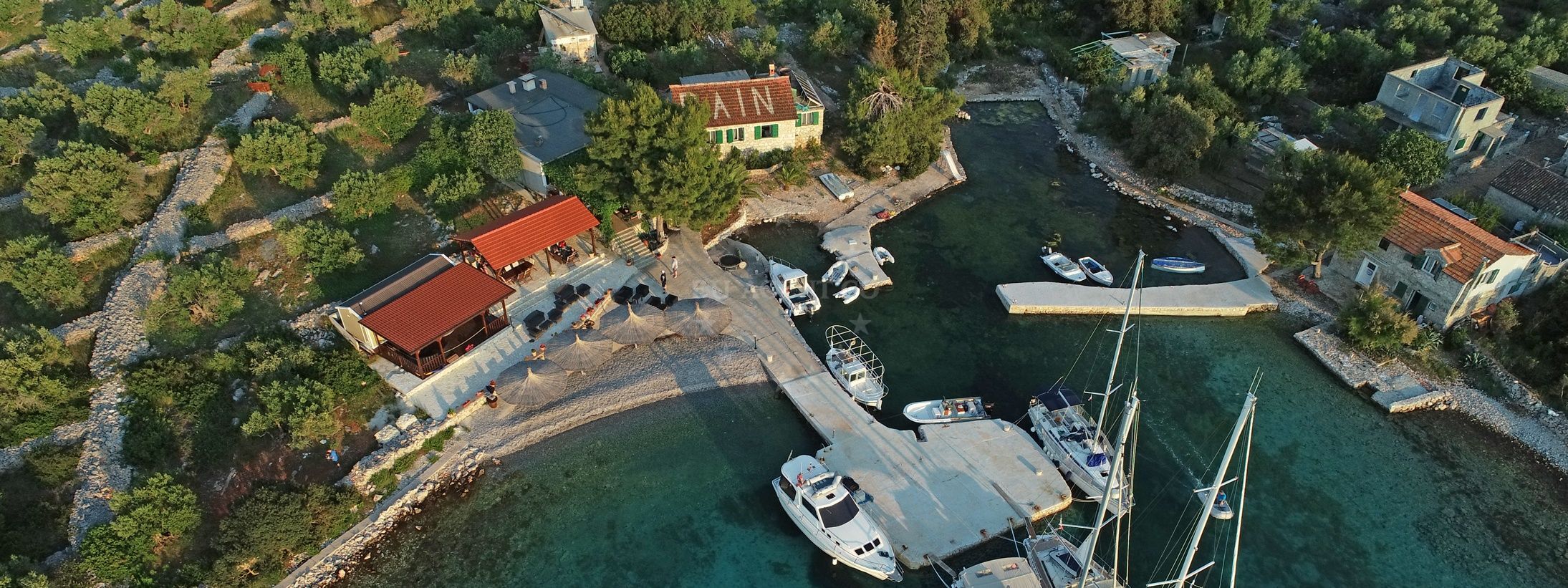 Konoba Bain Jetty in Strunac, Žut, North Dalmatia, Croatia with mooring lines