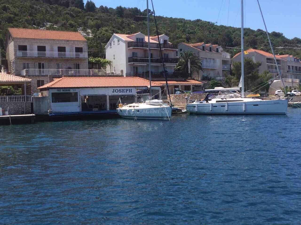 Konoba Joseph Dock quay in Polace, Mljet, Croatia with mooring lines