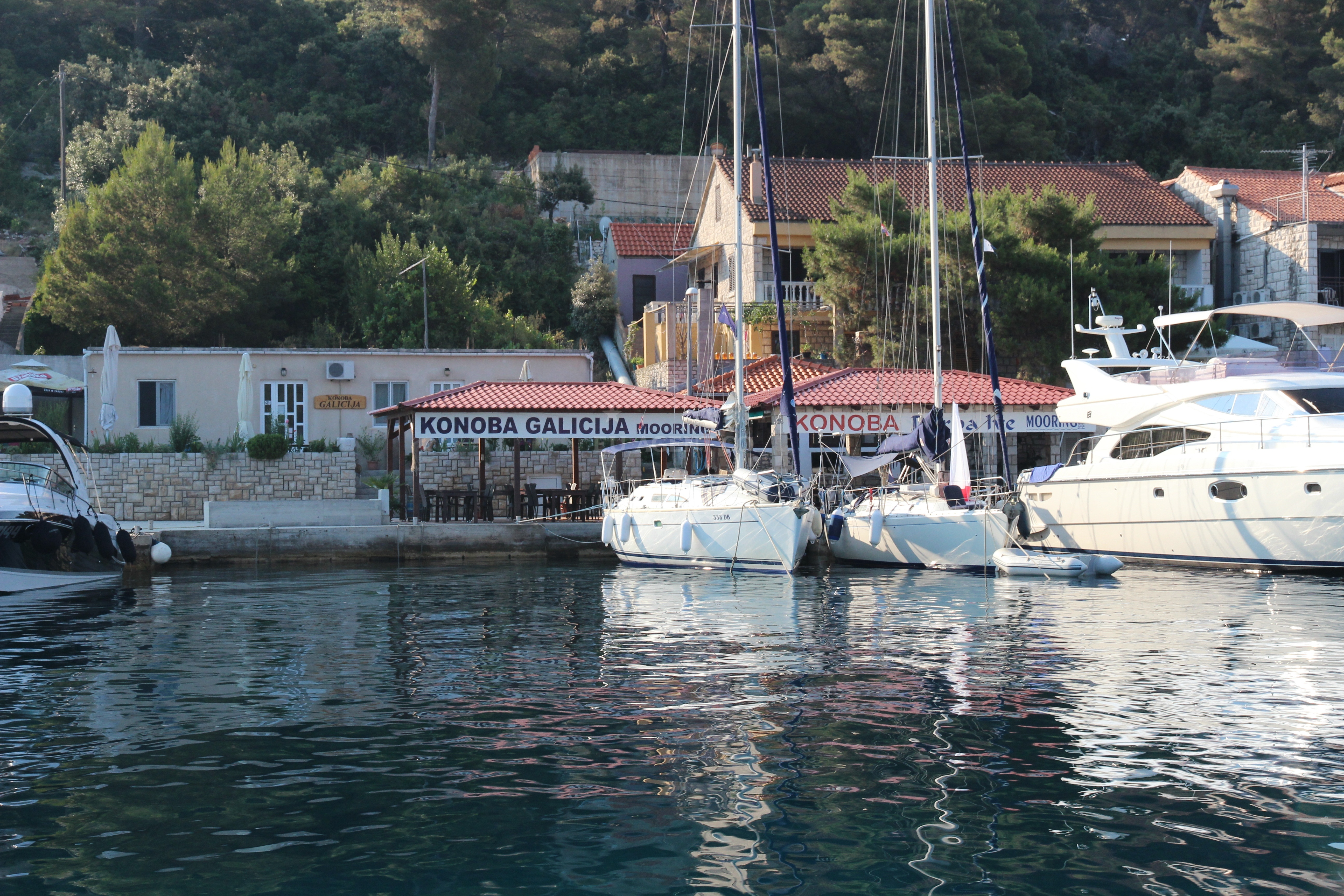 View of Konoba Ribar restaurant and quay from the Adriatic Sea