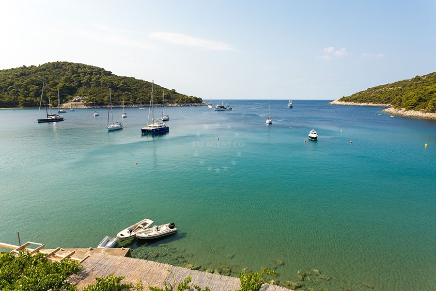 Buoy field at Konoba Kod Ante, Saplunara, Mljet, Croatia with clear waters and pine trees