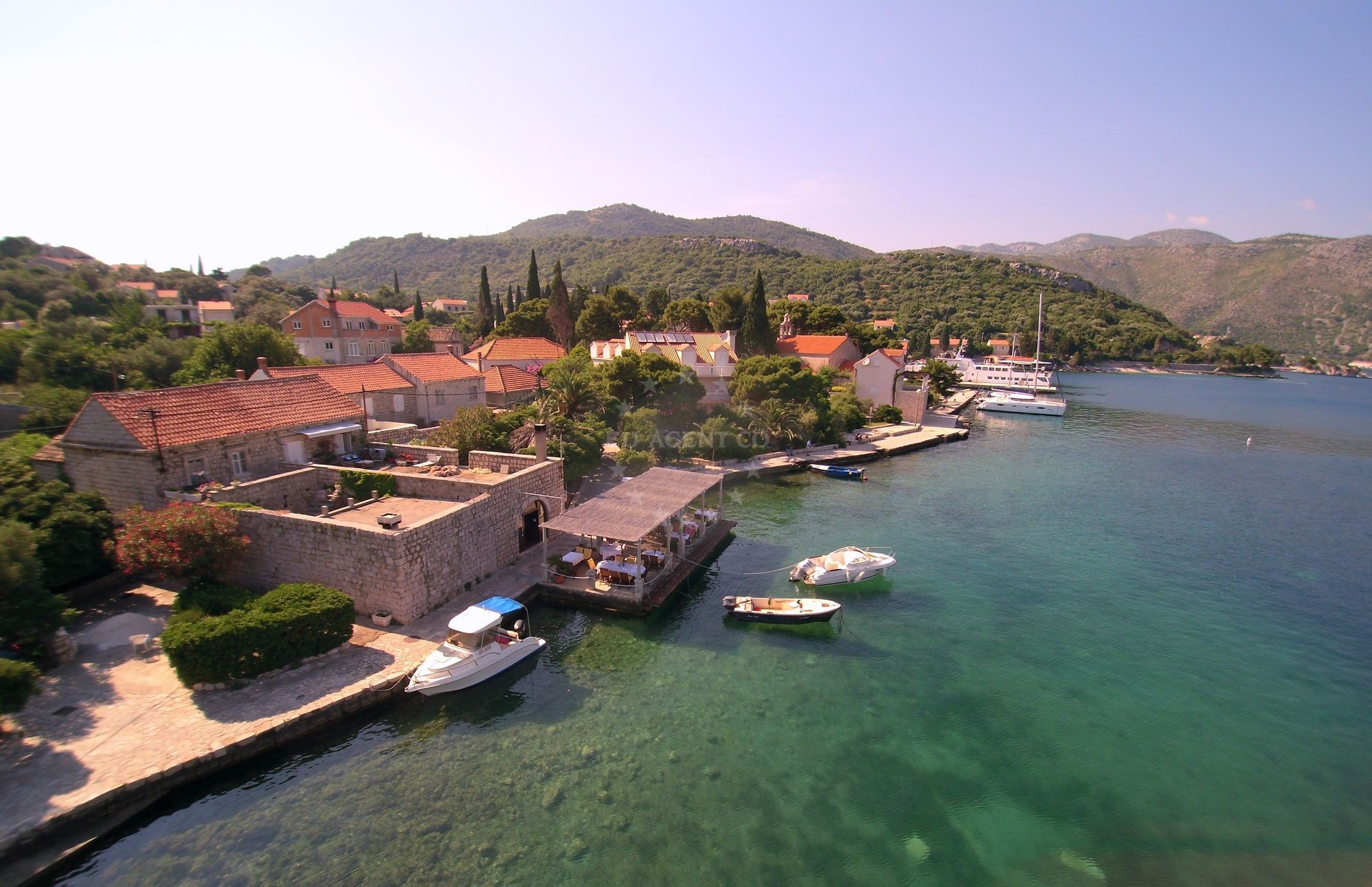 Konoba Kasar Jetty in Zaton, Croatia with mooring lines secured to concrete anchors
