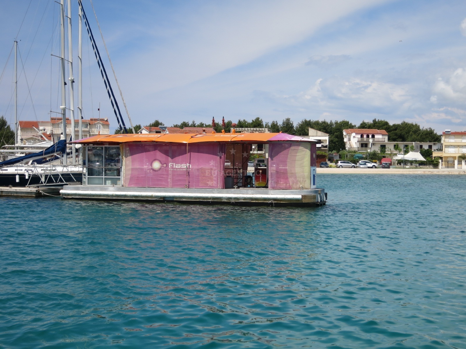 Flash Fuel Station in Rogoznica, Central Dalmatia, Croatia with nearby Marina Frapa in the distance.