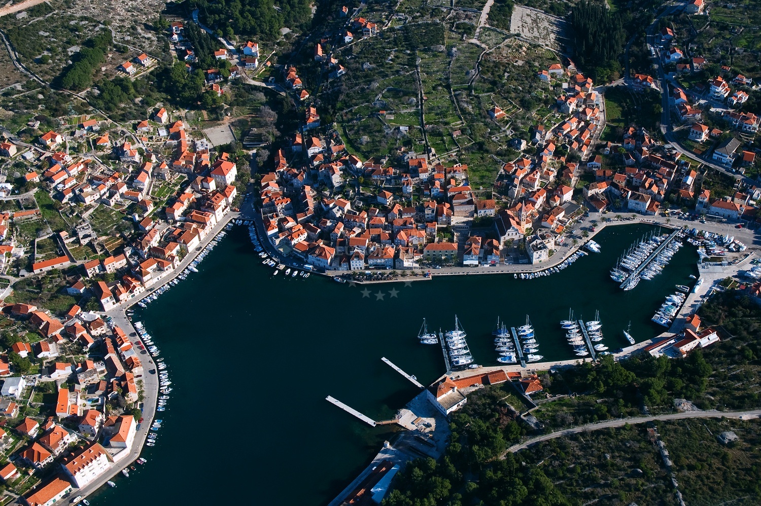 Milna Harbour entrance with quay and nearby ACI Marina Milna