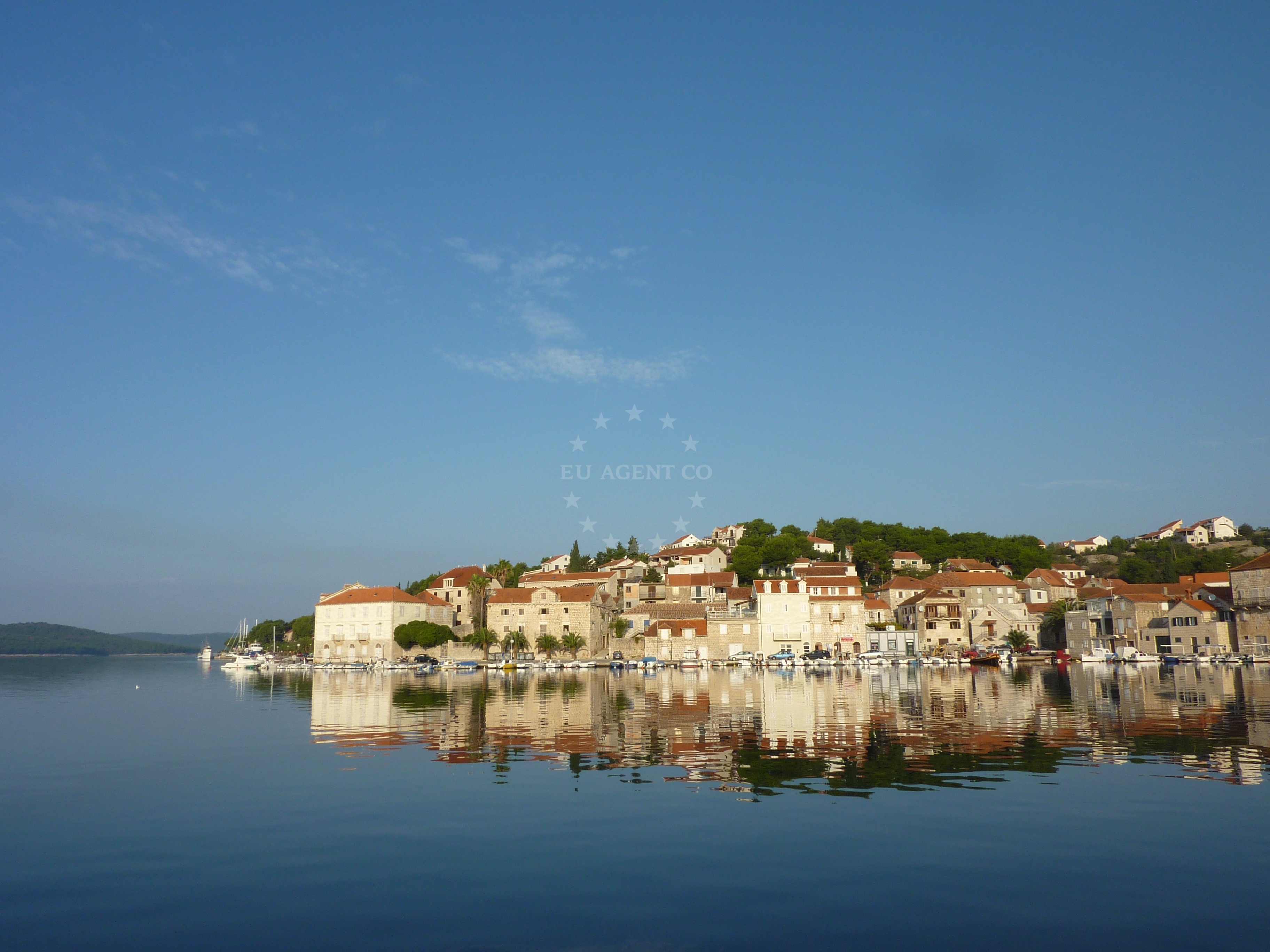 Historic Milna village with boats docked at the harbor