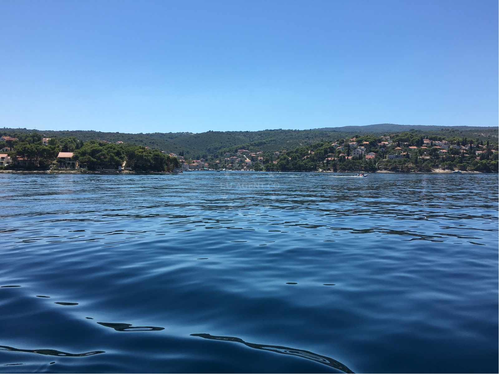 Splitska Harbour, Brač Island, Croatia: A view of the harbor with boats anchored nearby.