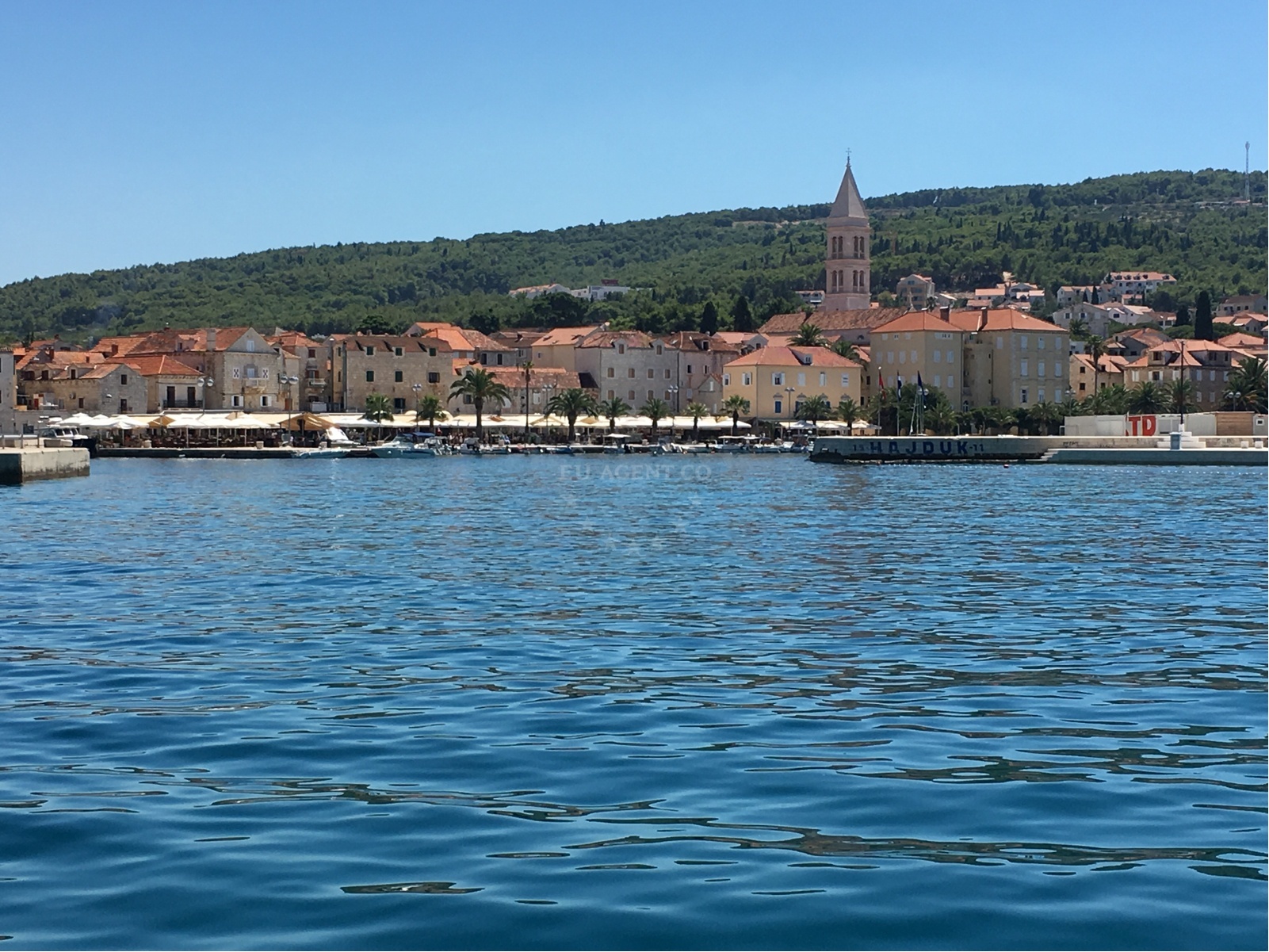 Harbor view showing the ferry port and limited mooring lines available for guests