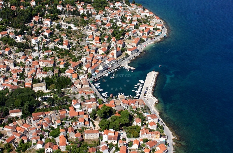 Sutivan Harbour entrance with boats moored near the northern breakwater