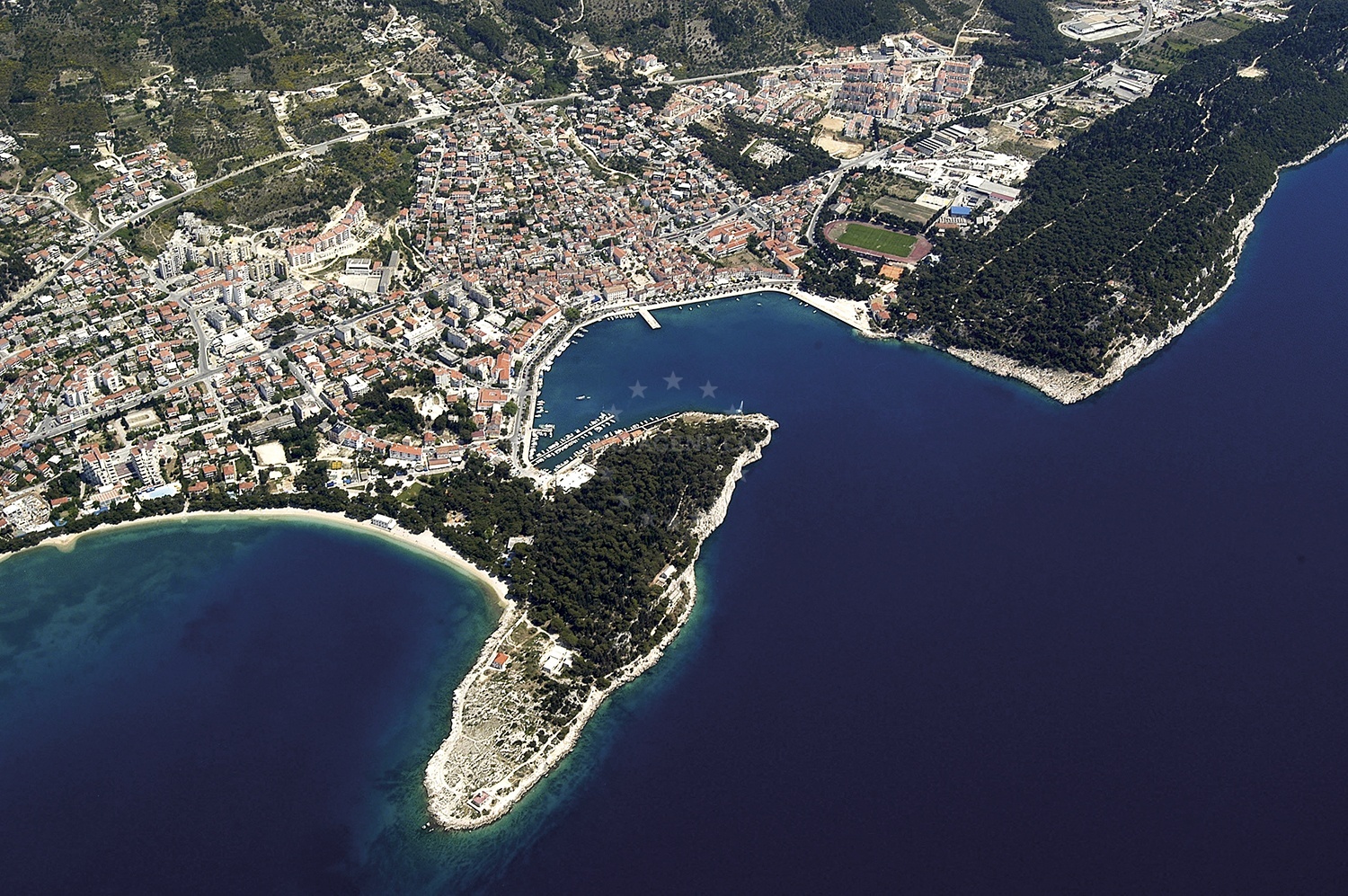 Makarska Harbour with yachts moored along the breakwater