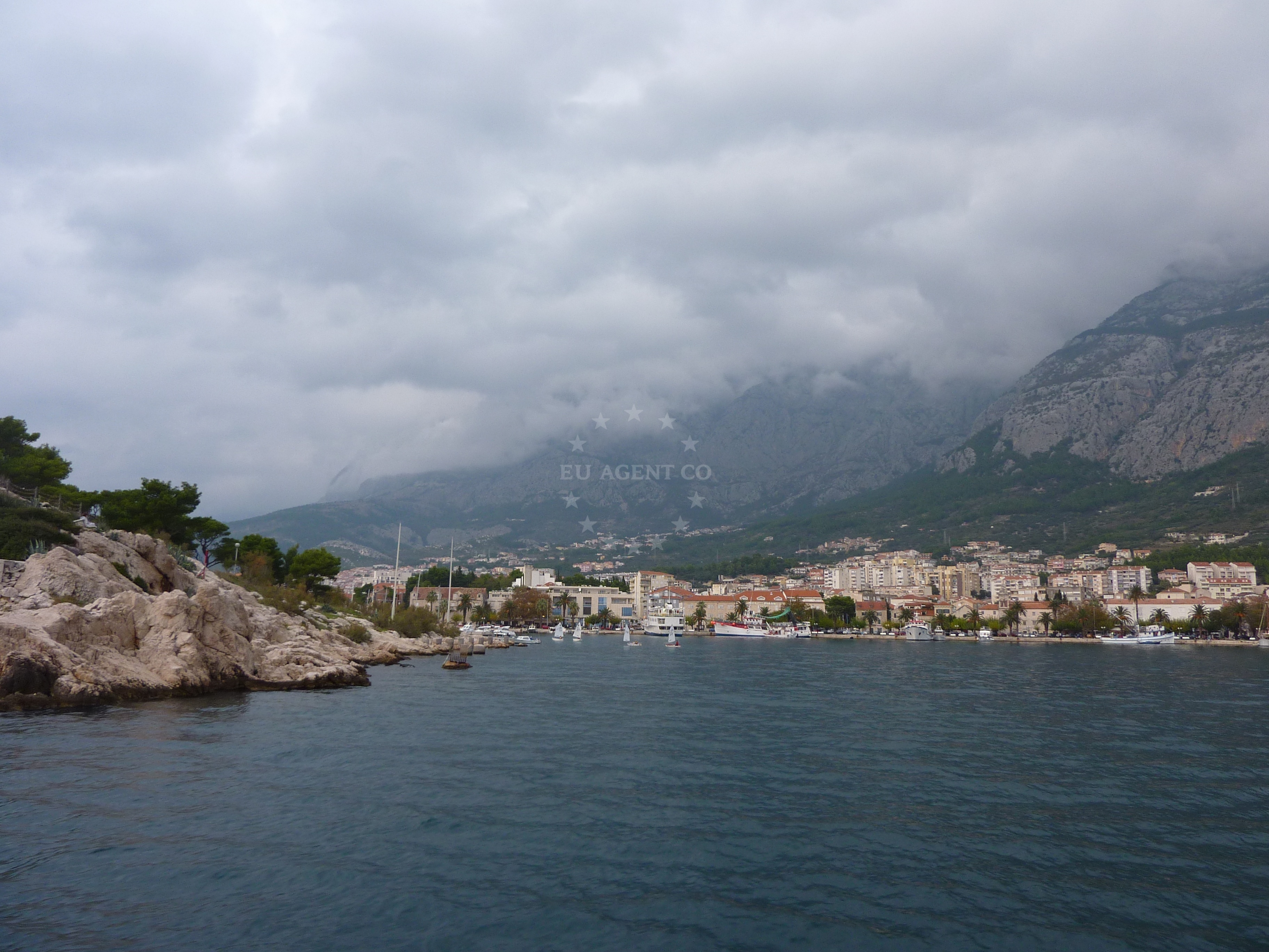 Lively promenade at Makarska Harbour with restaurants and shops