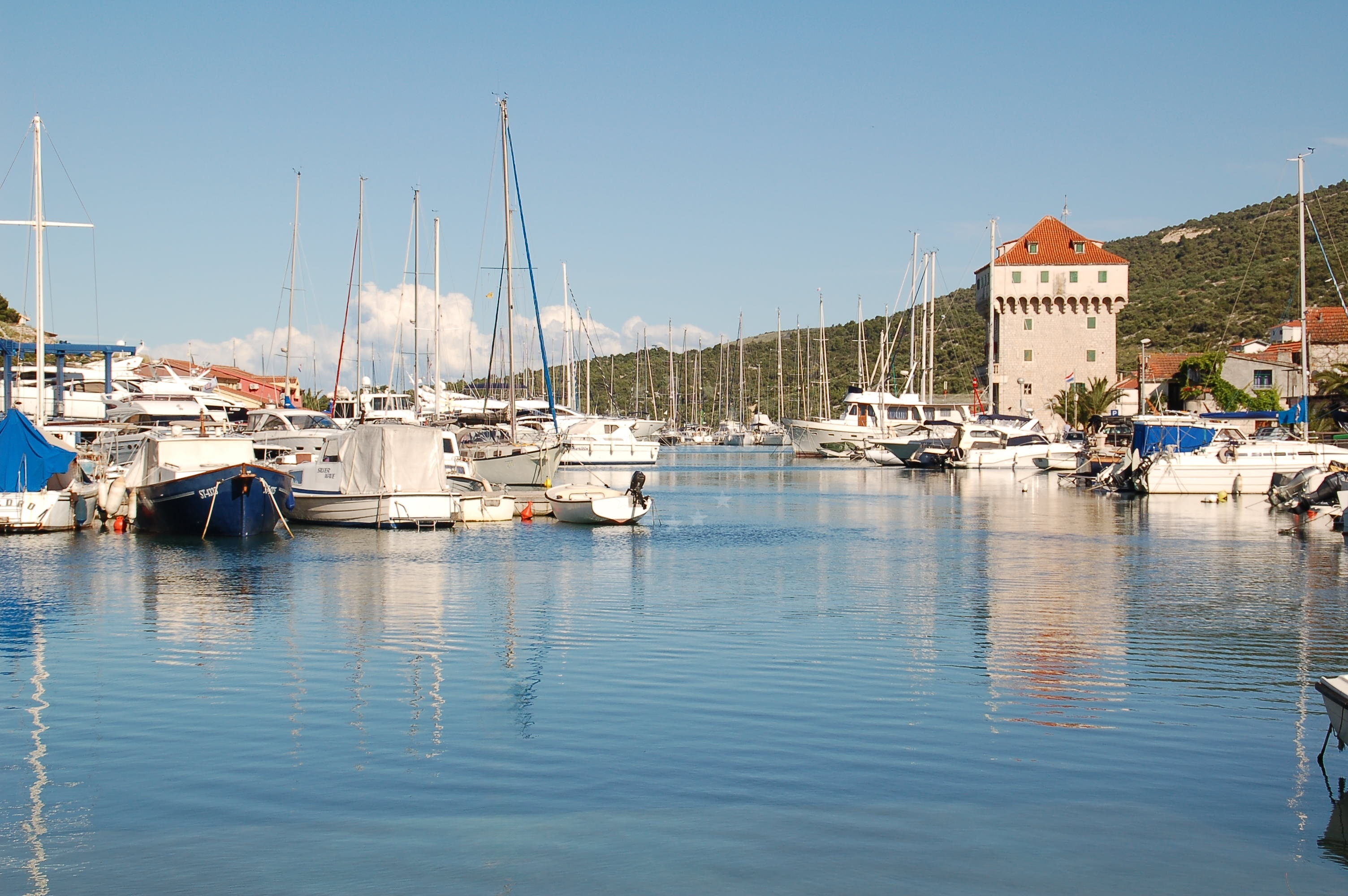 Marina Harbour quay with mooring lines and traditional Croatian boats