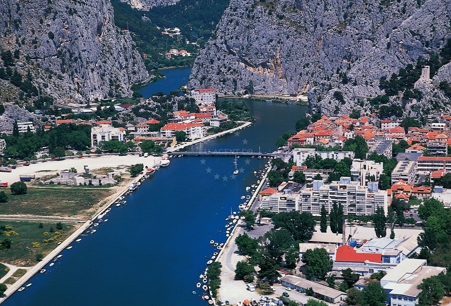 Omis Harbour jetty with yachts moored alongside