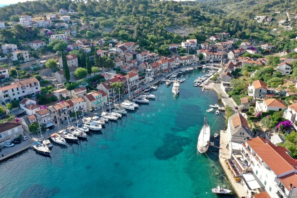 Stomorska Harbour, Šolta Island, Croatia - View of the natural bay with yachts moored at berths.