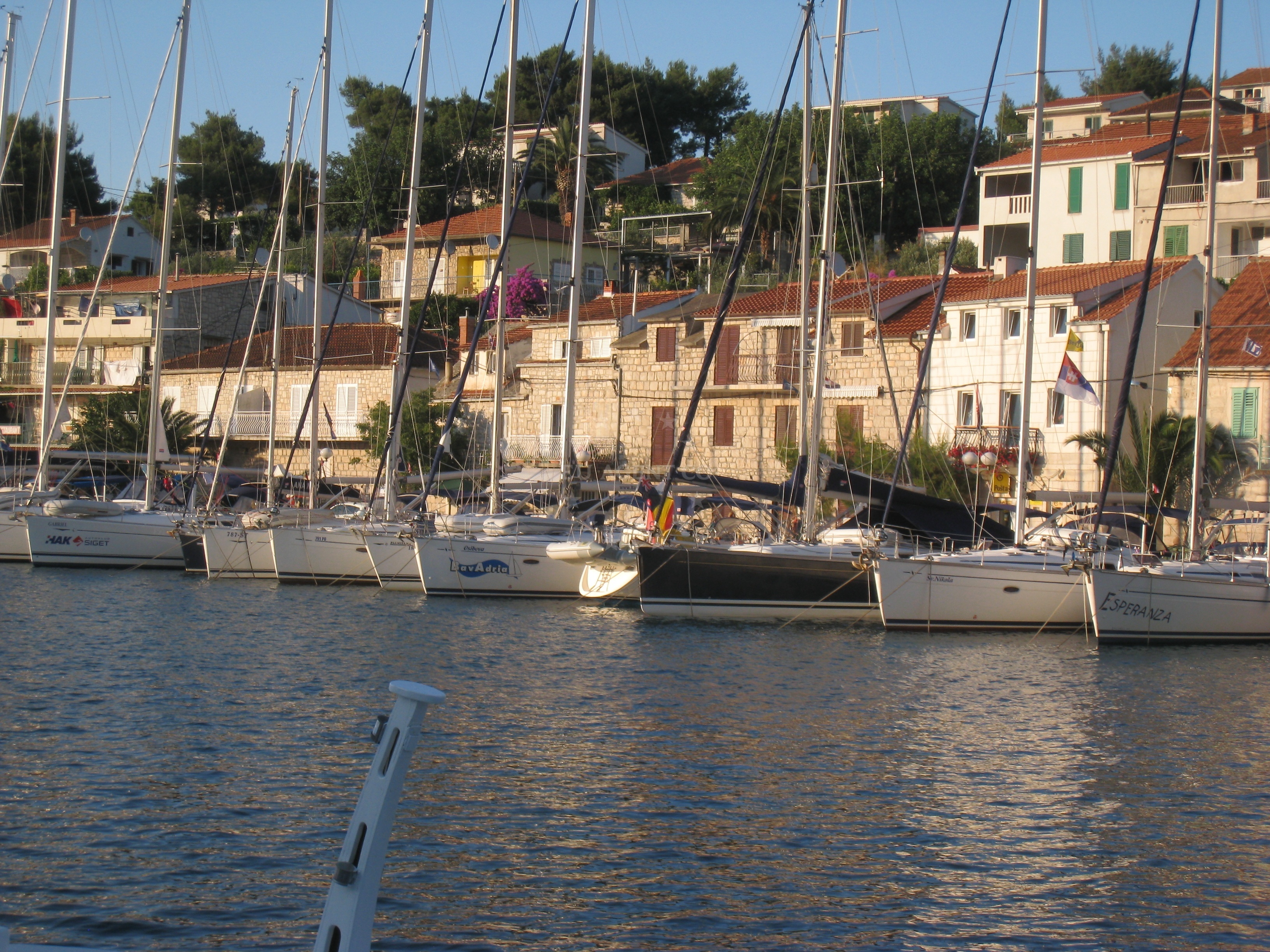Stomorska Harbour, Šolta Island, Croatia - View of the small supermarket and nearby restaurants along the waterfront.