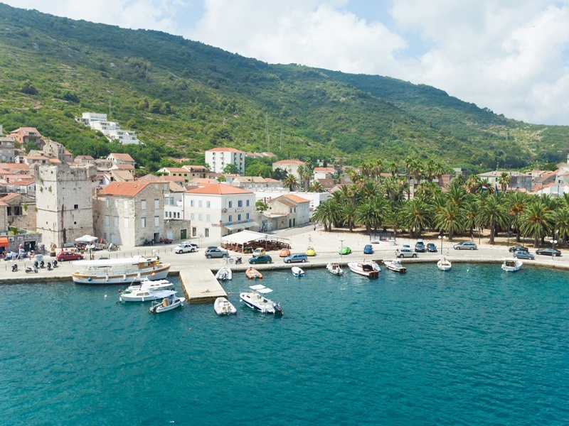 Yachts moored at Komiza Harbour with electricity and water facilities