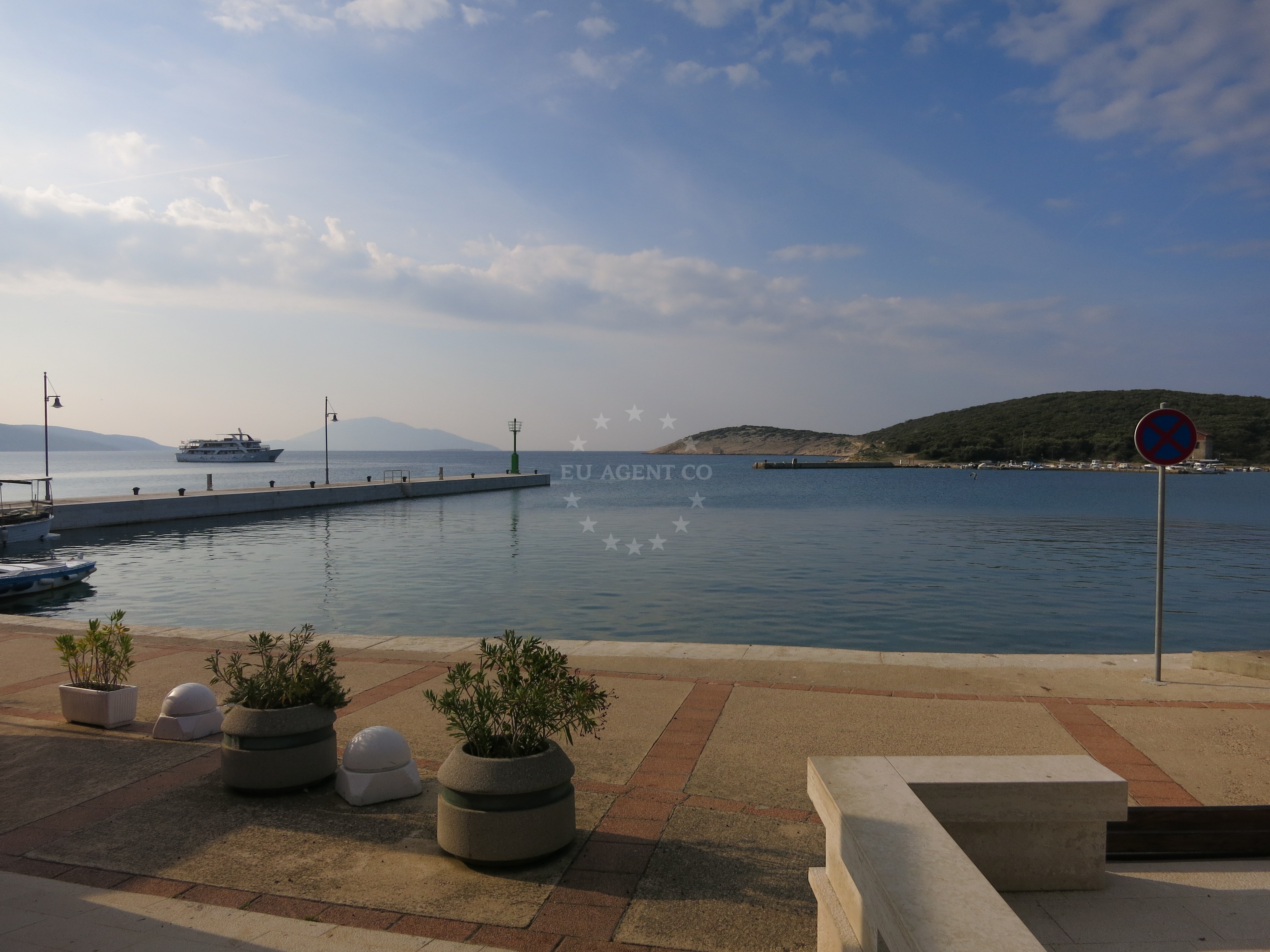 Martinscica Harbour with village houses and new pier