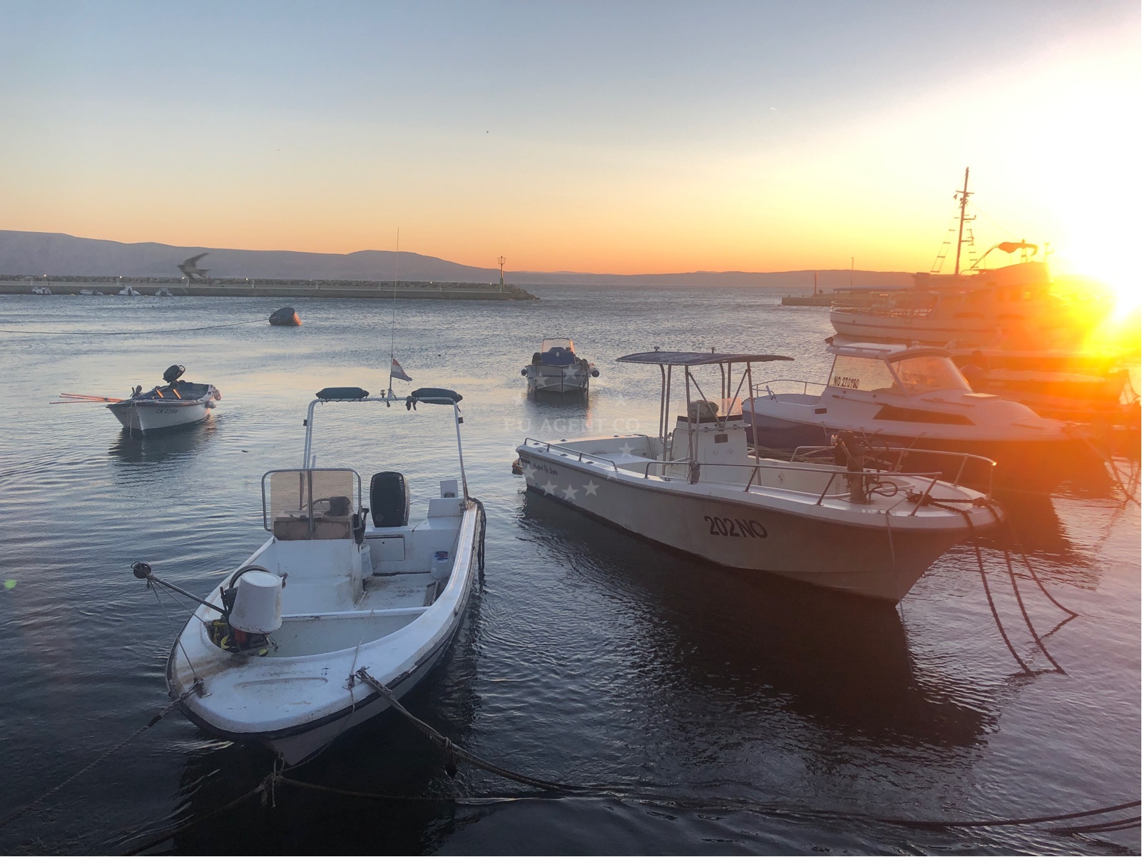 Klenovica Harbour with breakwater and moored yachts